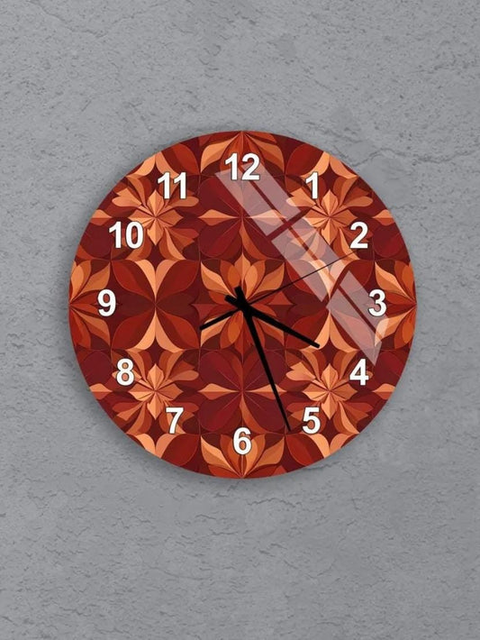 six round wall clocks with a red and orange geometric pattern, arranged in a grid on a gray background.