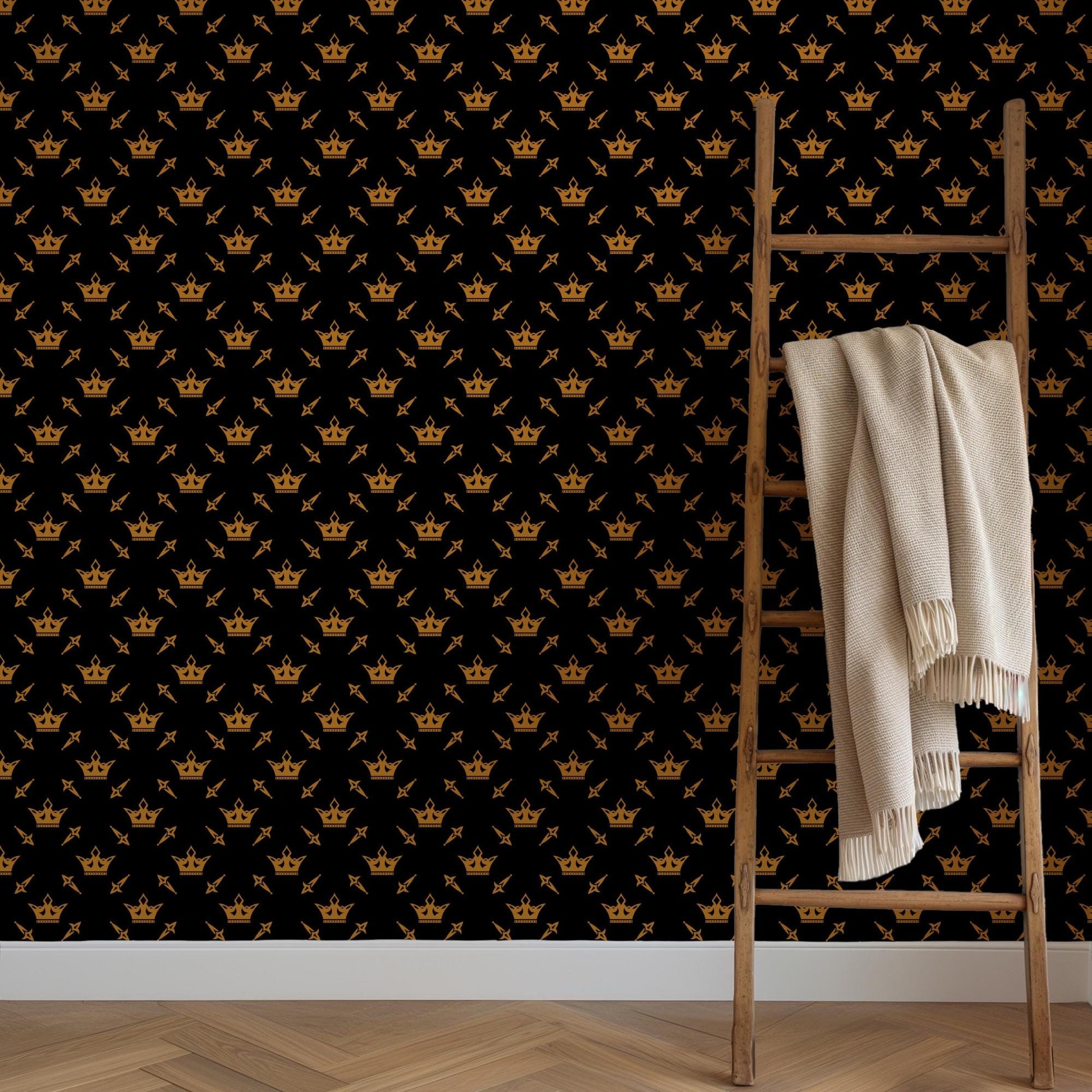 a wooden ladder leaning against a wall with a repeating pattern of golden crowns on a black background.