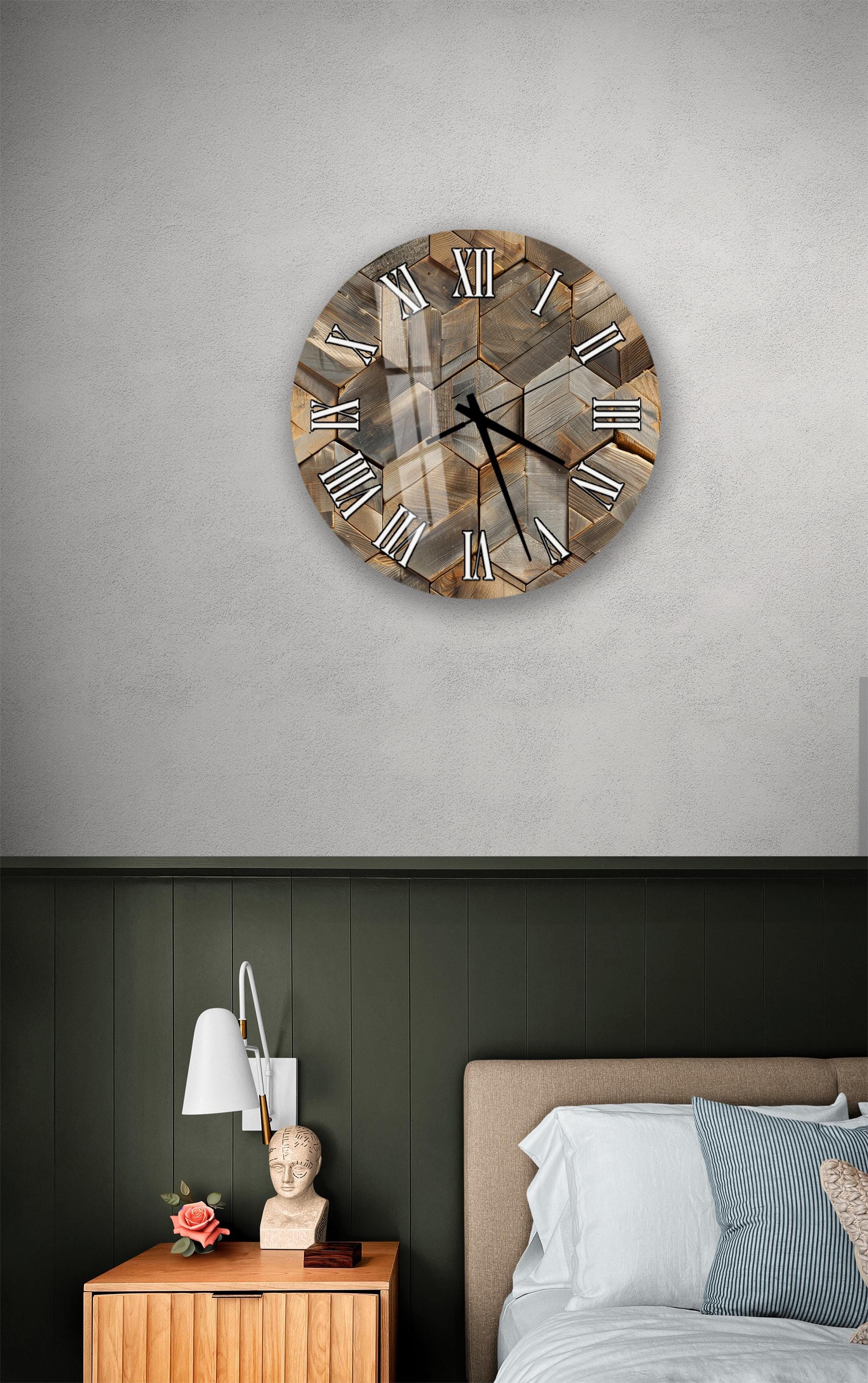 a bedroom setting with a wooden wall clock, a nightstand with a lamp, and a bed with white sheets.