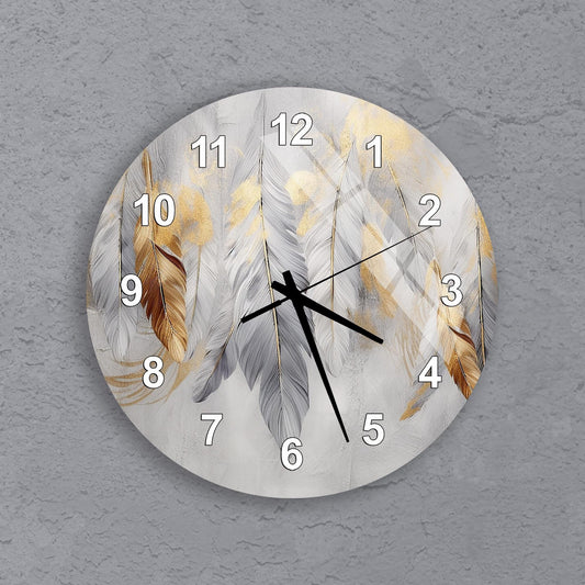 A wall clock with a feather design on its face.