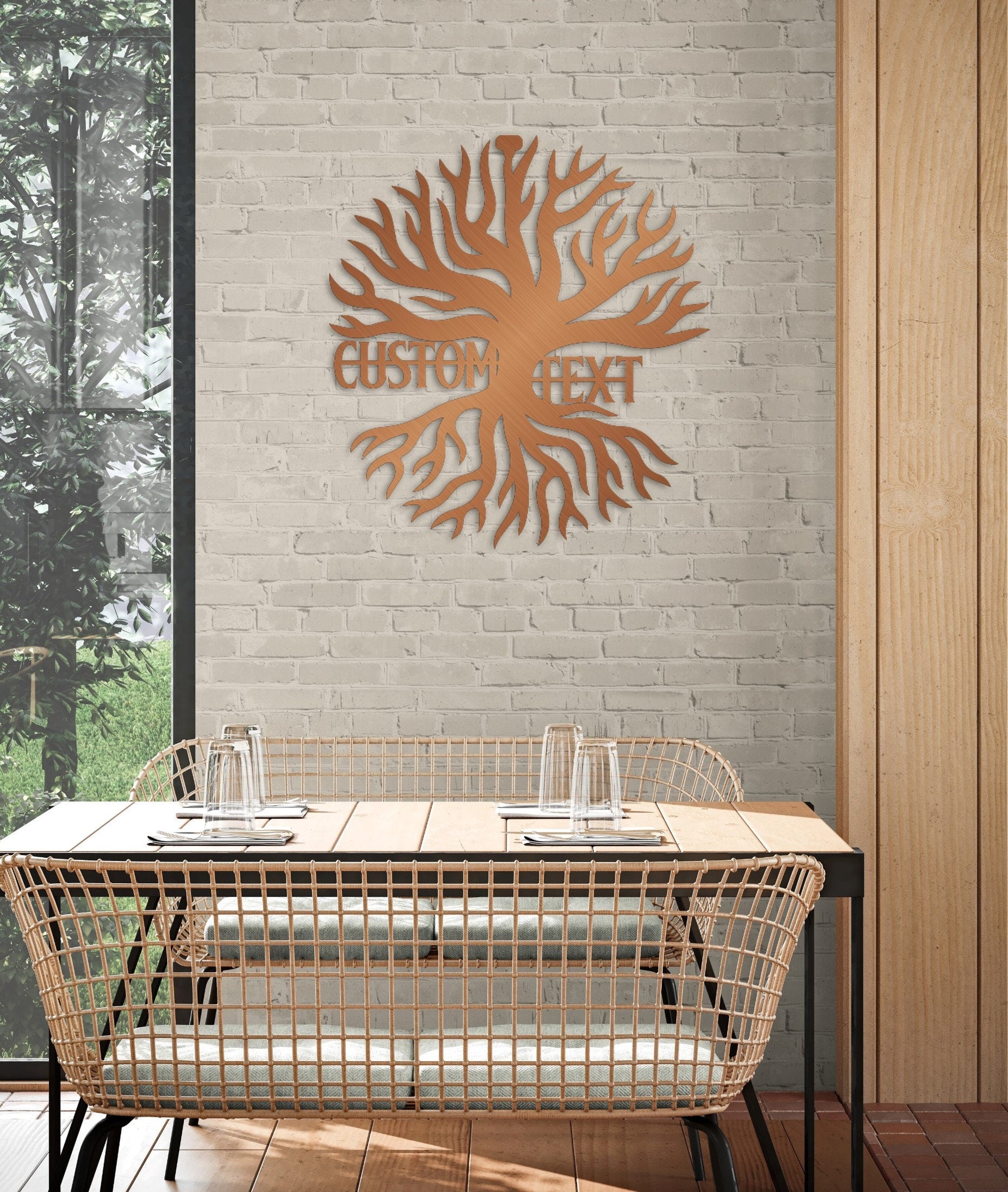 a table with two glasses on it in front of a brick wall
