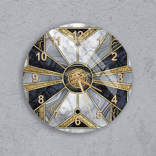 A wall clock with a gold and black marble design, featuring a central clock face with gold hands and numbers, and a dark background with a light gray texture.
