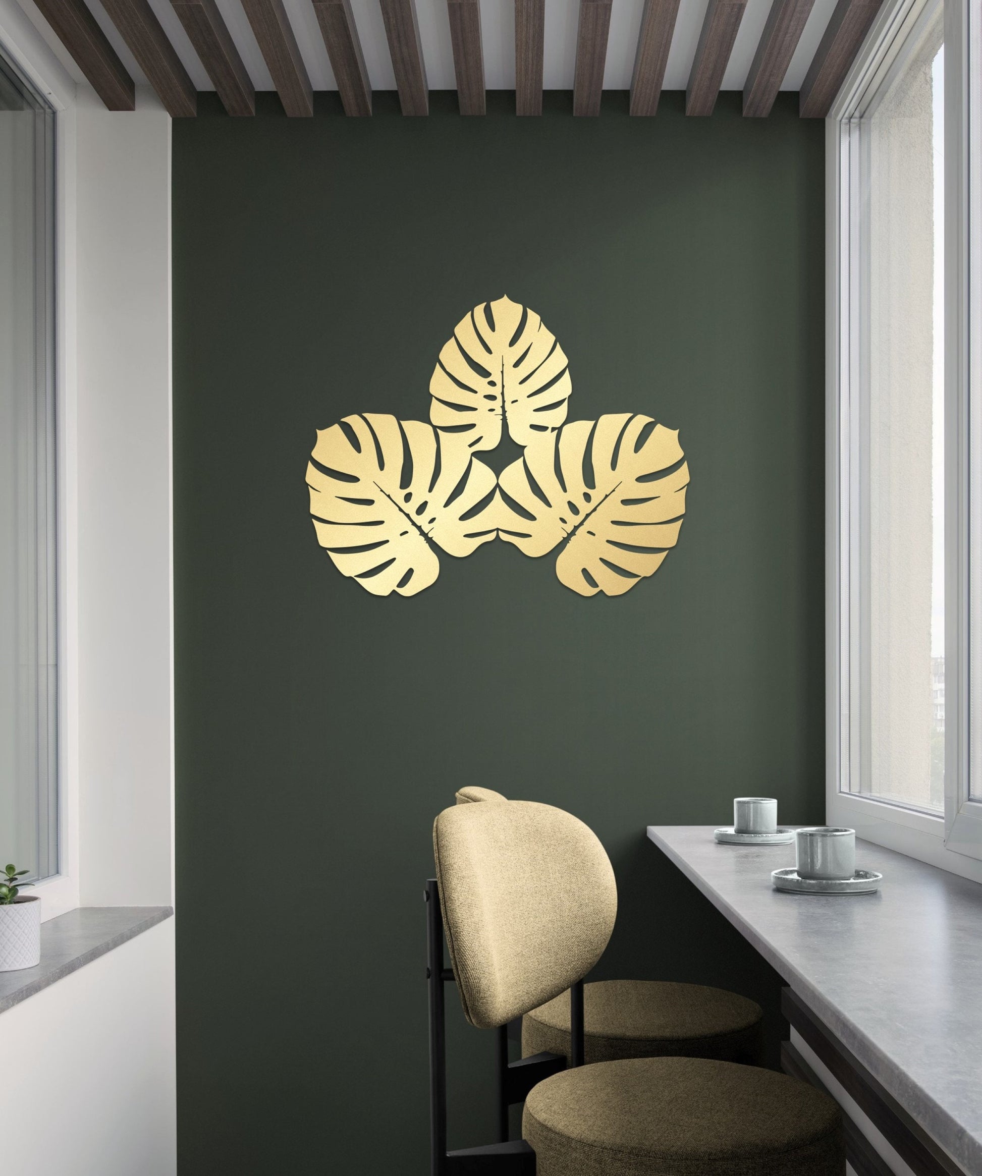 a room with a chair and a wall with a plant on it