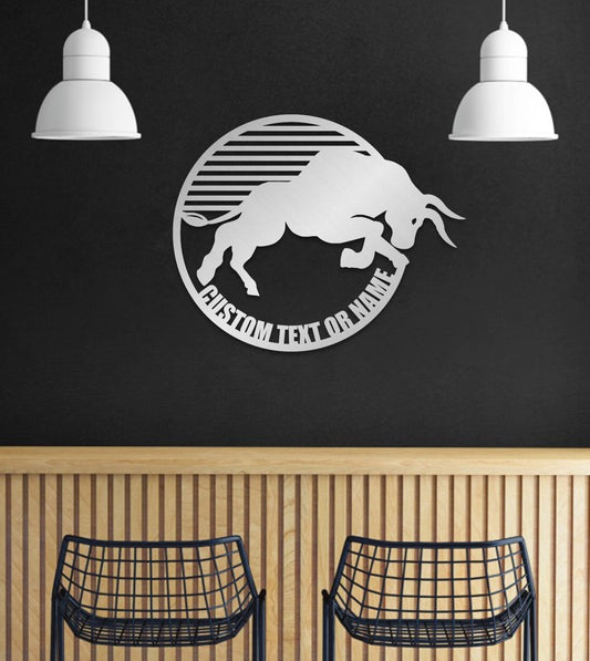 May include: A metal wall decor with a white silhouette of a bull jumping in a circle with the text 'CUSTOM TEXT OR NAME' around the outside.