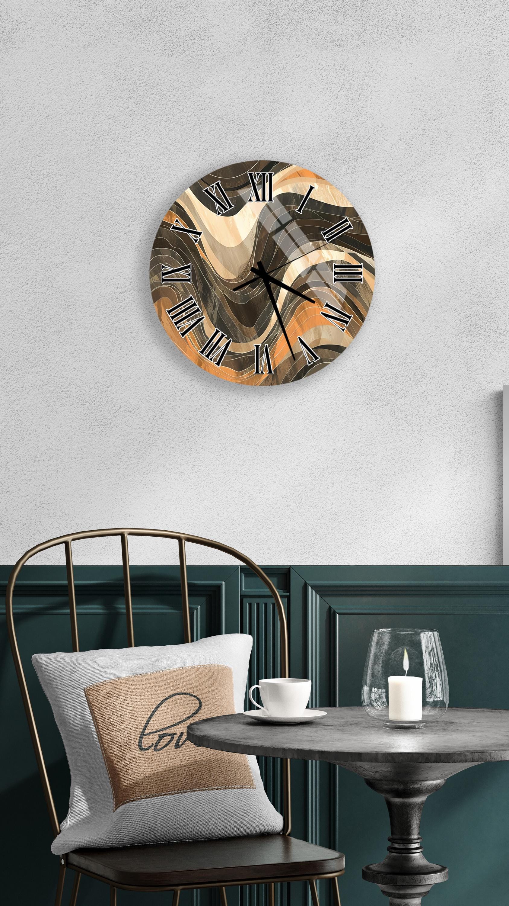 a modern wall clock with a unique abstract design, mounted on a wall above a dining table with a white tablecloth.