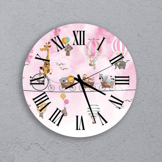 A round wall clock with a pink background and various cartoon animal characters, including a giraffe, elephant, and lion, along with a bicycle and hot air balloons.