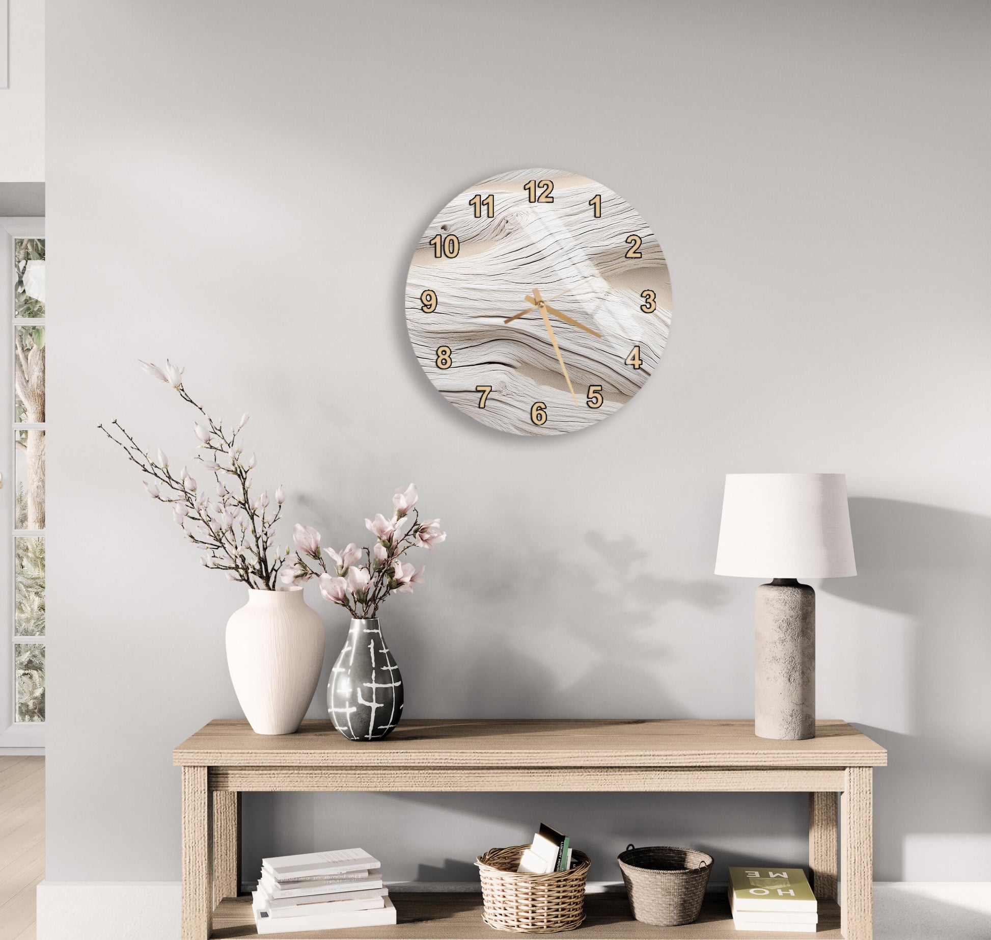 a modern living room with a wooden console table, a round wall clock, and various decorative items such as a vase with flowers, a lamp, and a stack of books.
