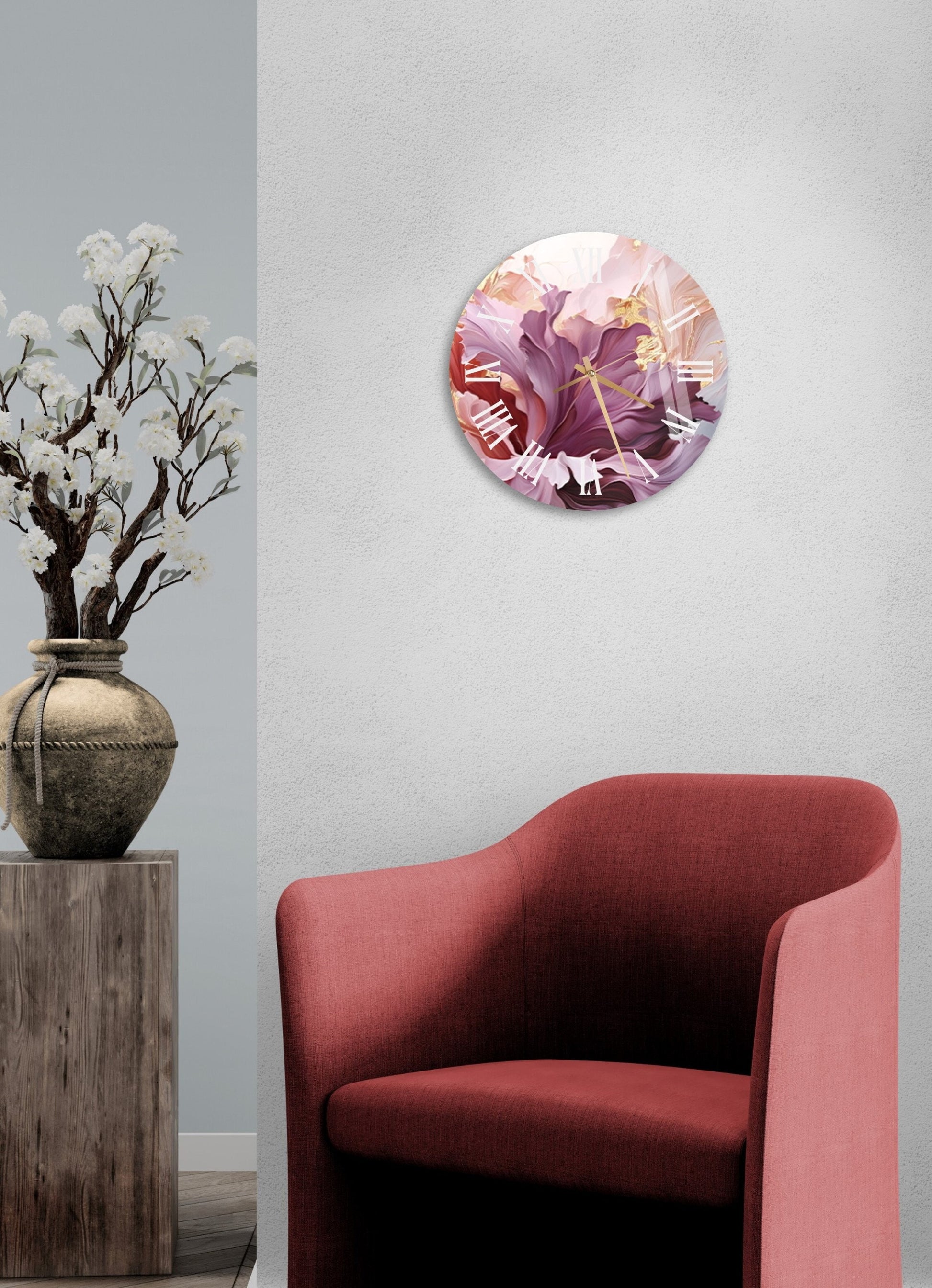 a red chair sitting next to a vase filled with flowers