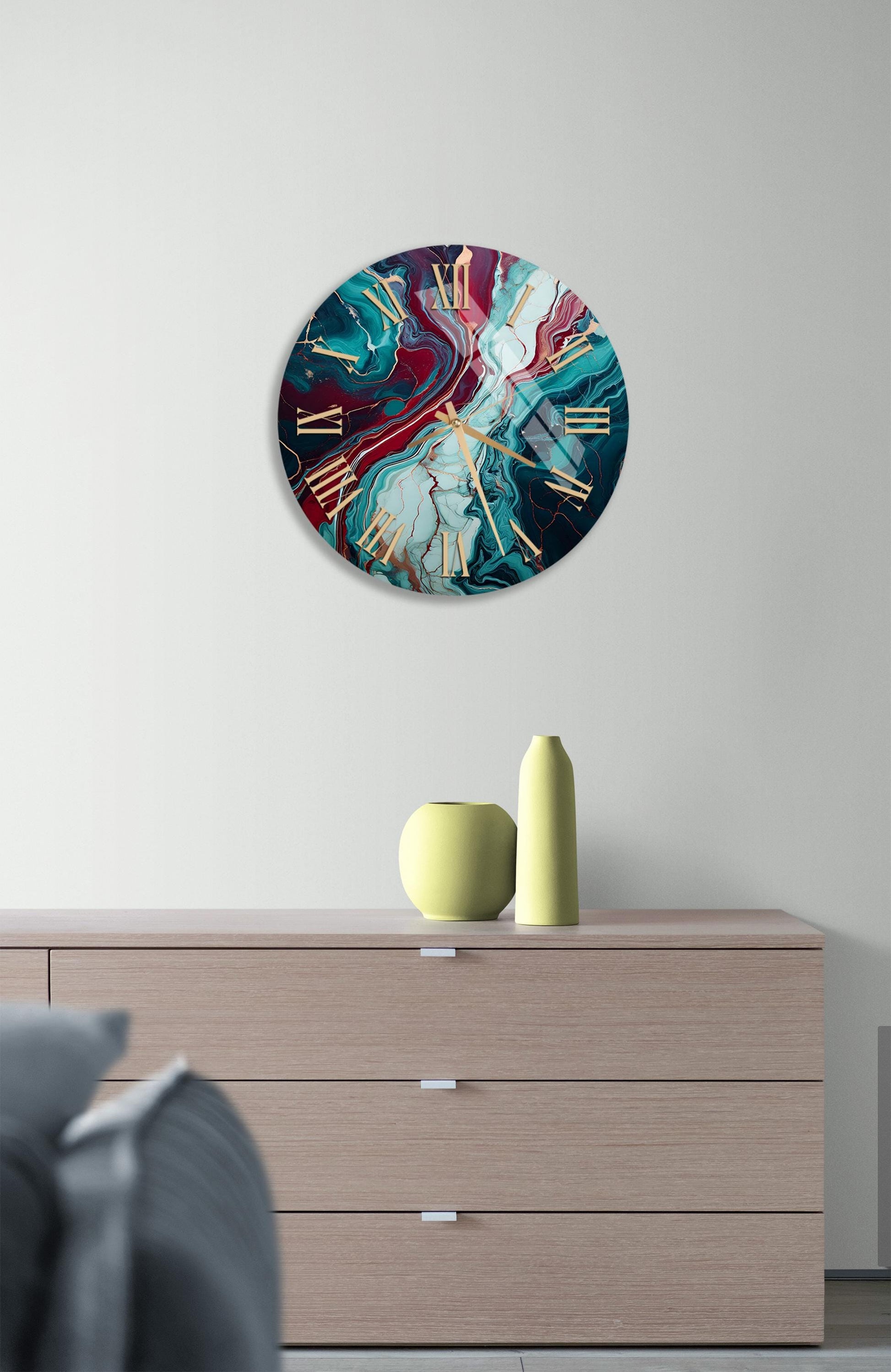 a clock on a wall above a dresser