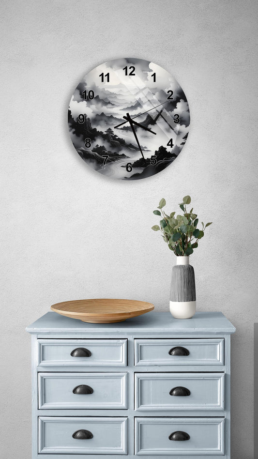 a wall clock with a black and white landscape design, mounted on a wall above a light blue dresser with six drawers. The dresser also has a vase with greenery and a wooden tray on top.