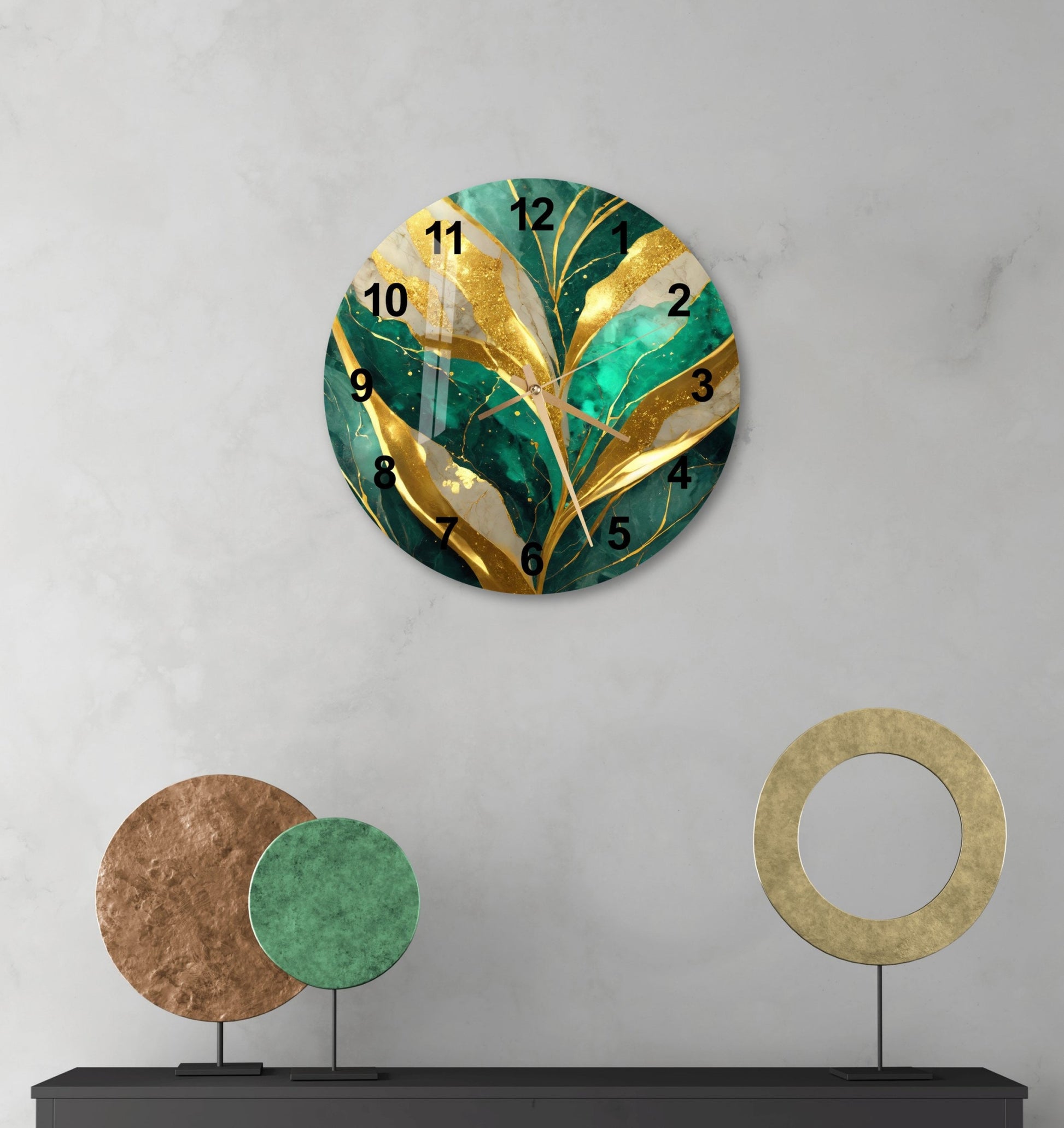 a wall clock with a green leaf design on it