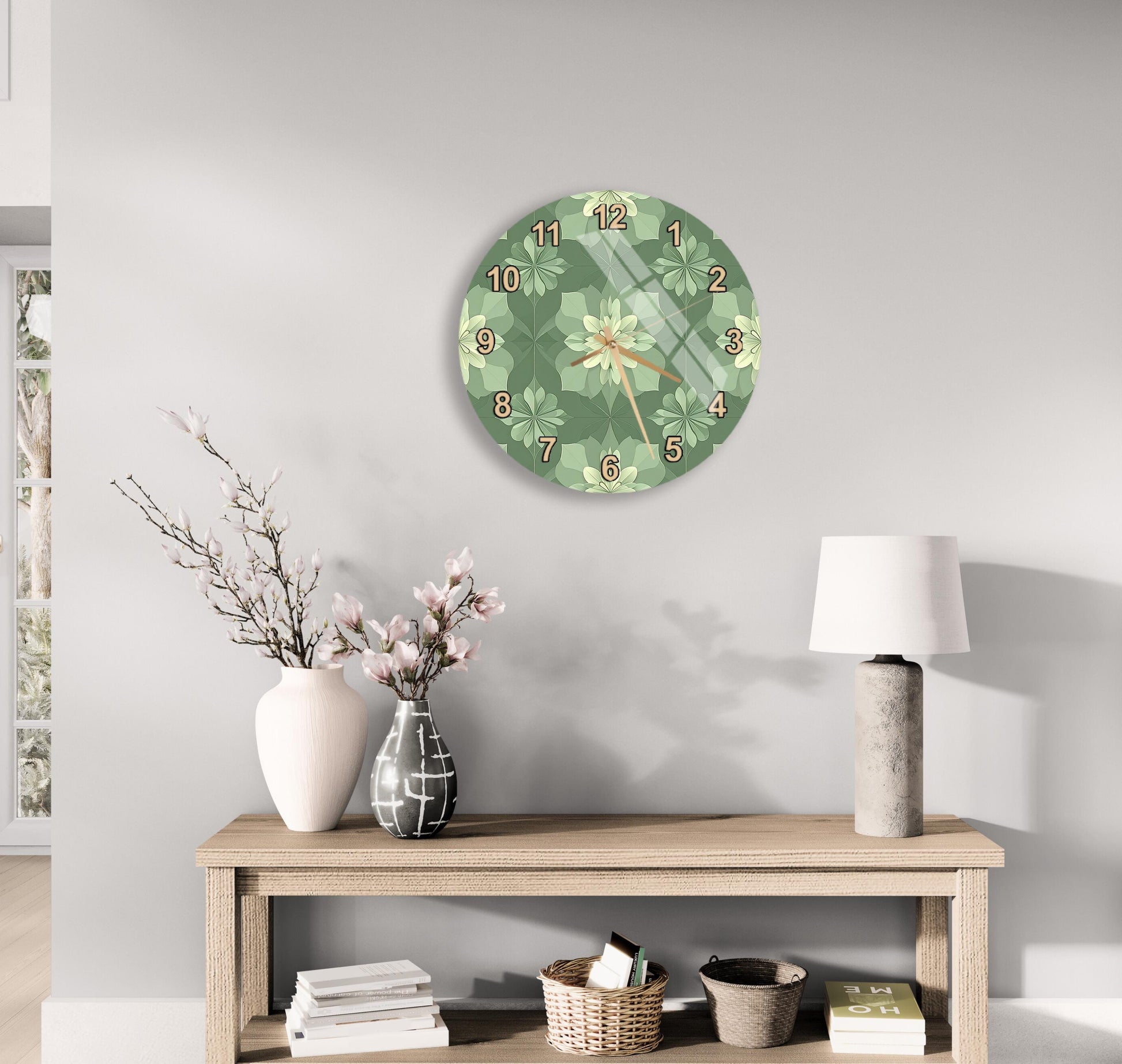 a modern living room with a round clock on the wall, a wooden table with a lamp, a vase with flowers, and a stack of books.