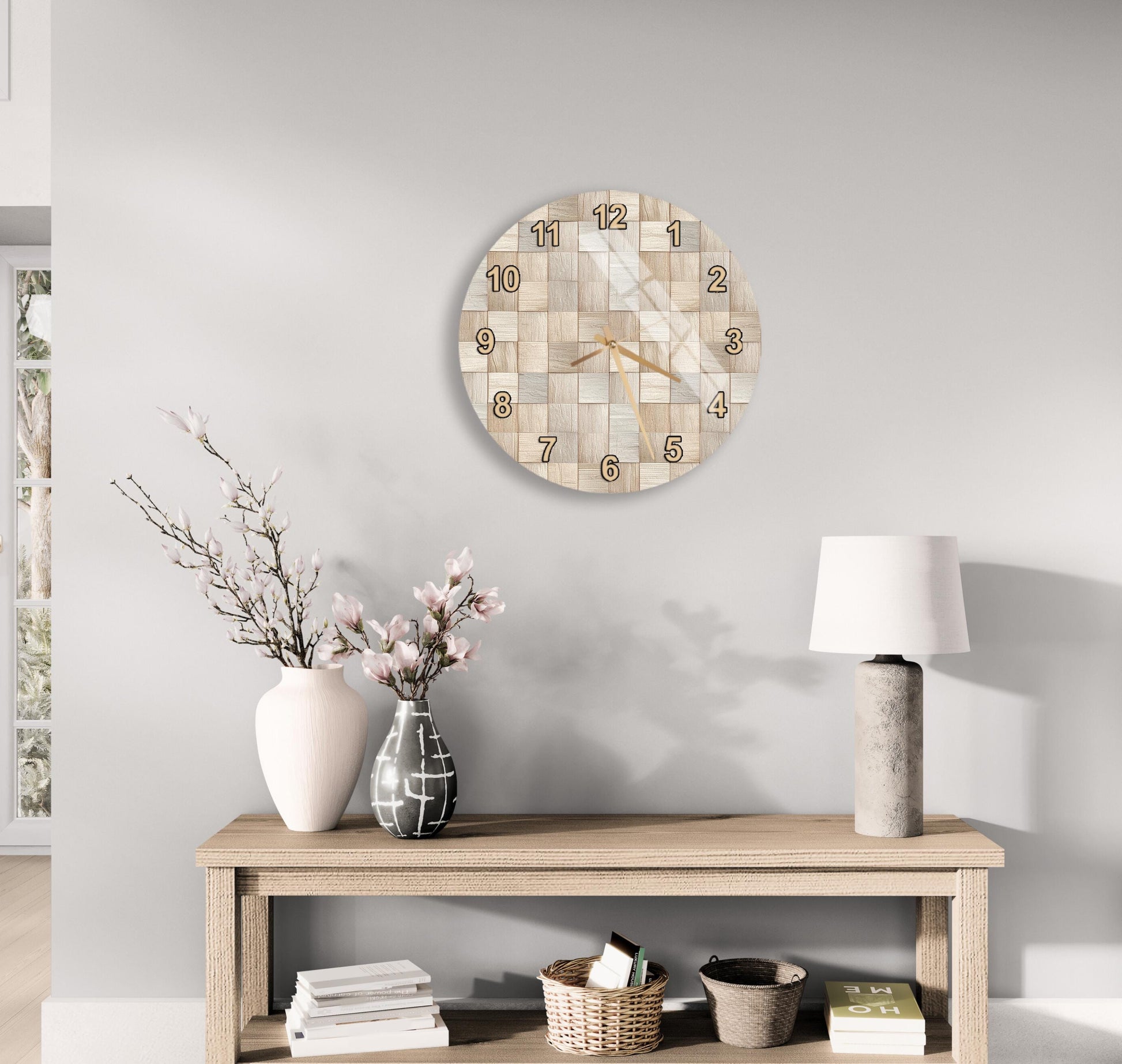 a modern living room with a wooden table, a lamp, a clock, and some decorative elements such as a vase with flowers and a book.