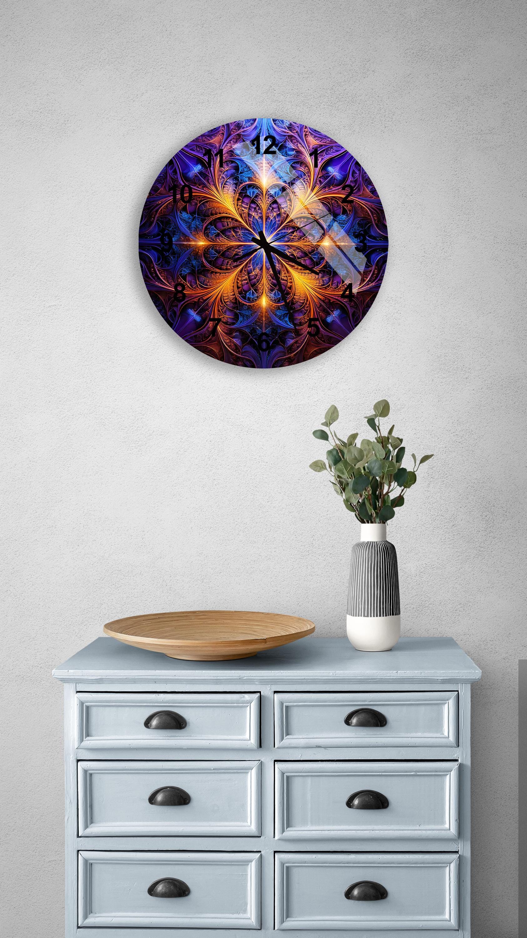 a blue cabinet with a vase of flowers on top of it