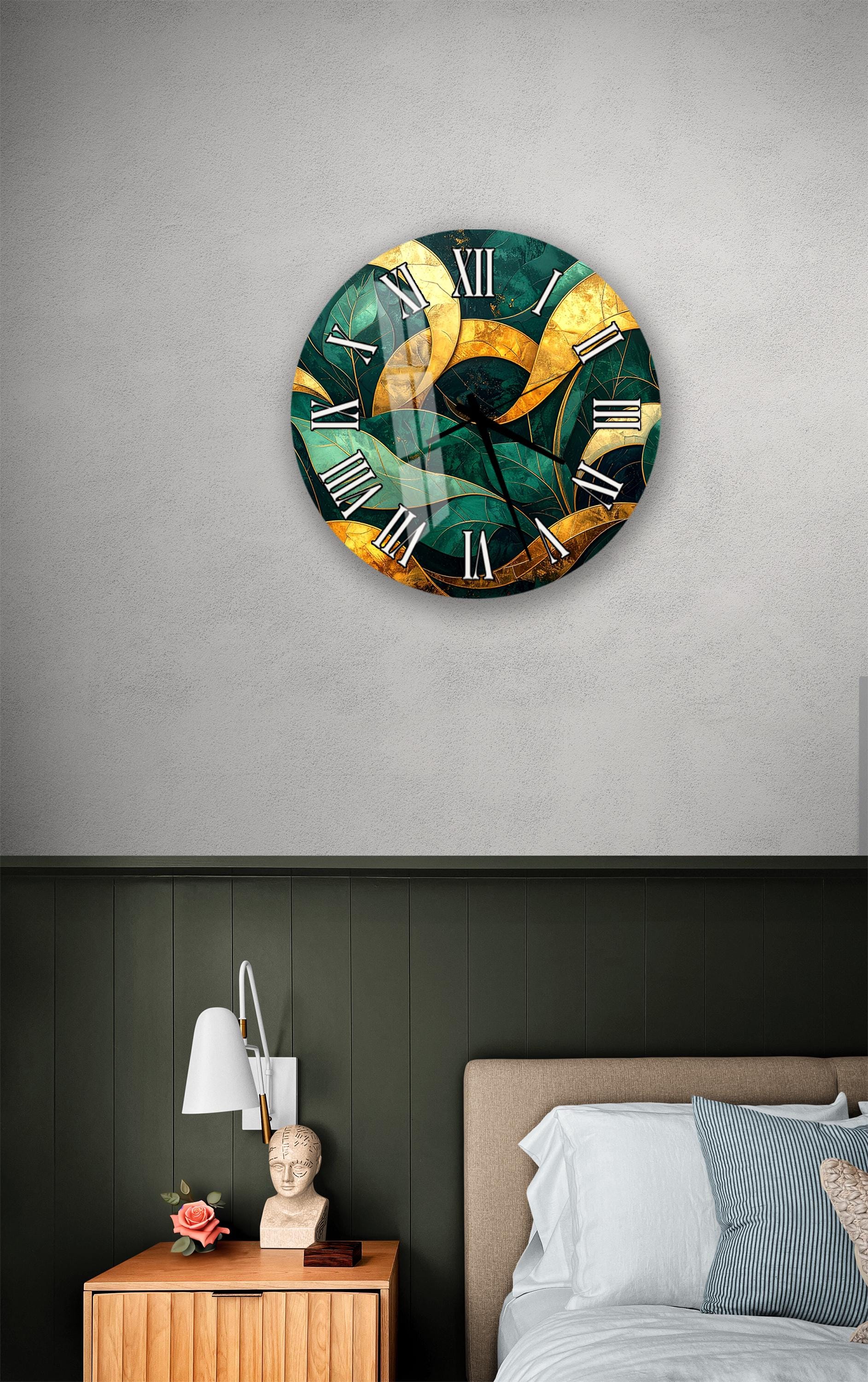 a bedroom setting with a large, colorful clock hanging on the wall above a bed. The clock has a unique, abstract design with shades of green and gold. The room also includes a nightstand with a lamp and a small statue or bust.