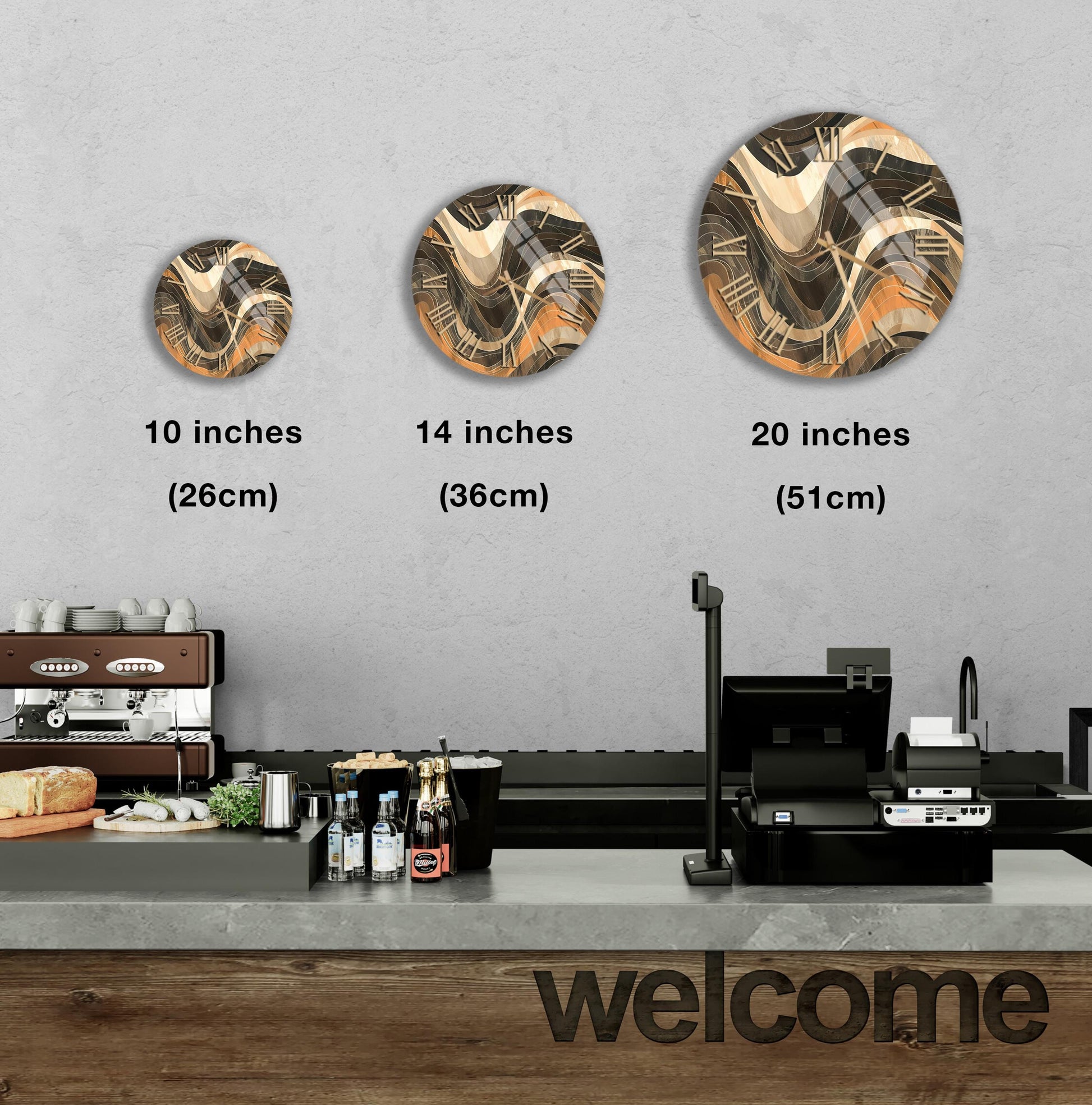 a counter in a restaurant with a "welcome" sign, and three different sizes of circular wall art displayed above the counter.