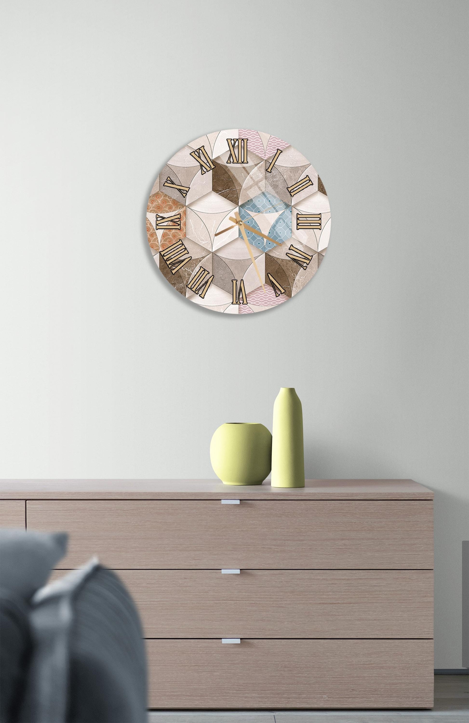 a modern living room with a wooden dresser, a round clock with a geometric design, and a small green vase on the dresser.