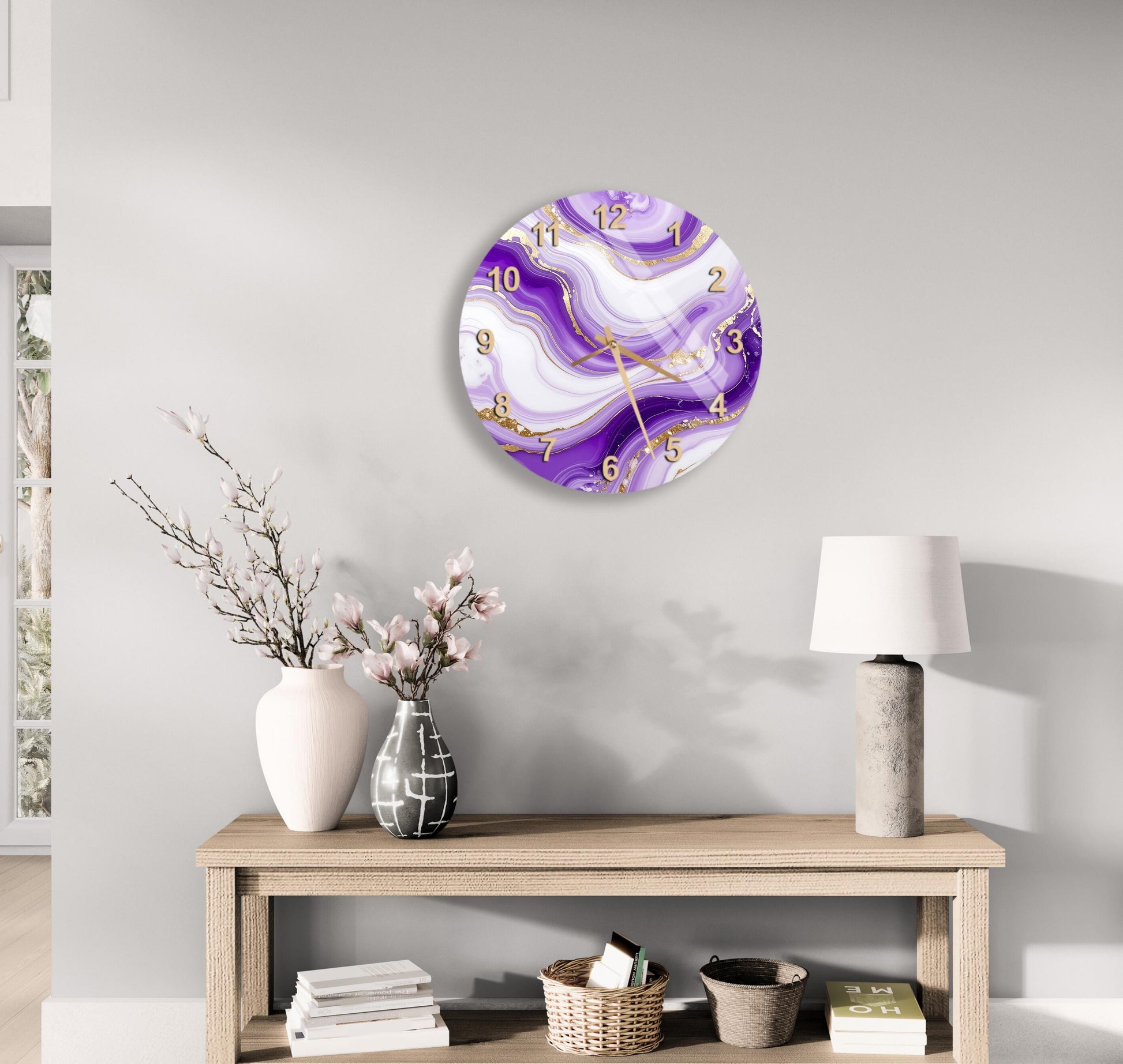 a modern living room with a wooden table, a lamp, a vase with flowers, and a clock with a purple and white marble design on the wall.