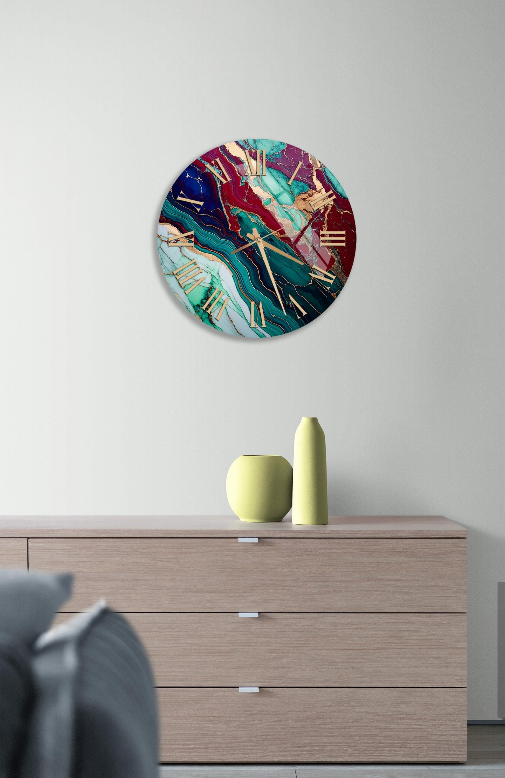 a clock on a wall above a dresser