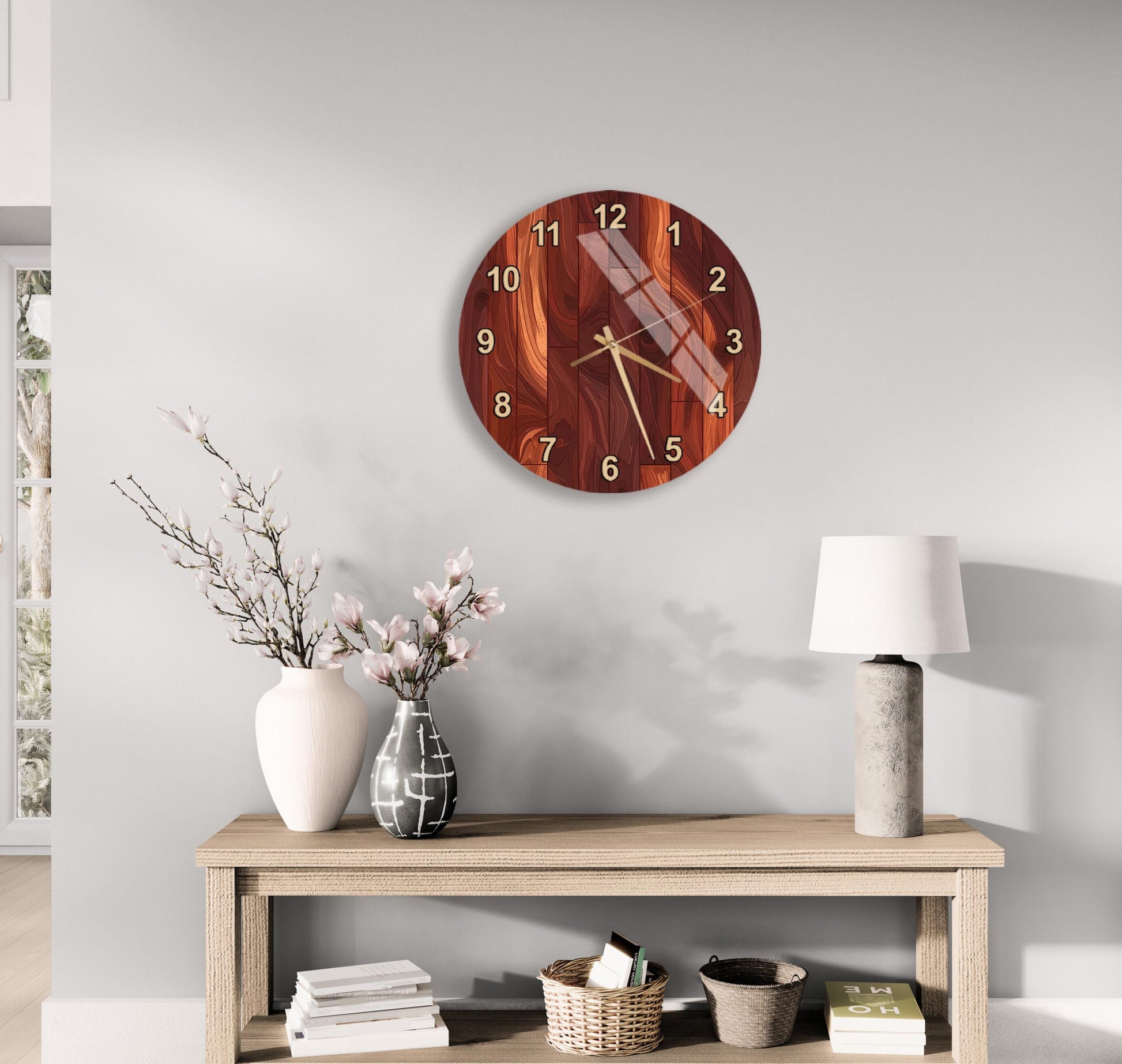 a wooden table with a clock, a lamp, and a vase with flowers, all set against a white wall.