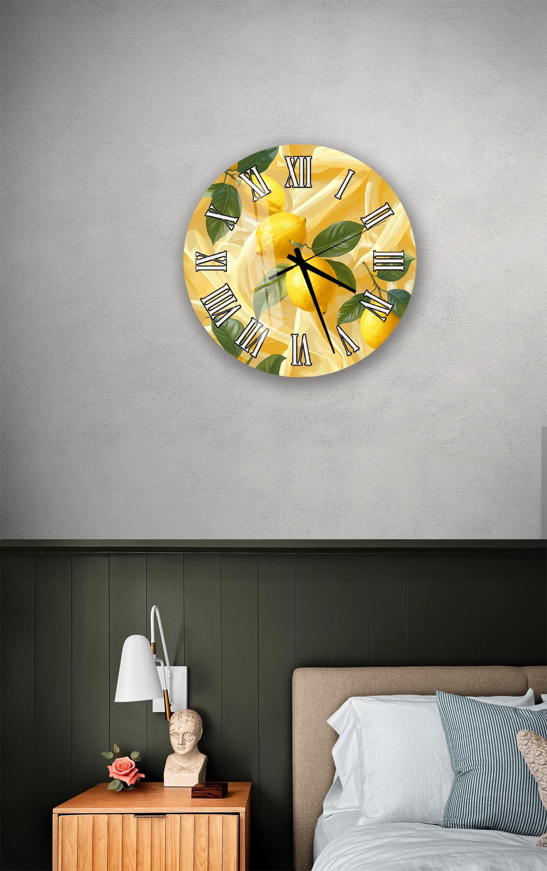a bedroom setting with a round wall clock displaying a yellow and green design, a wooden nightstand with a lamp, and a bed with white sheets and pillows.