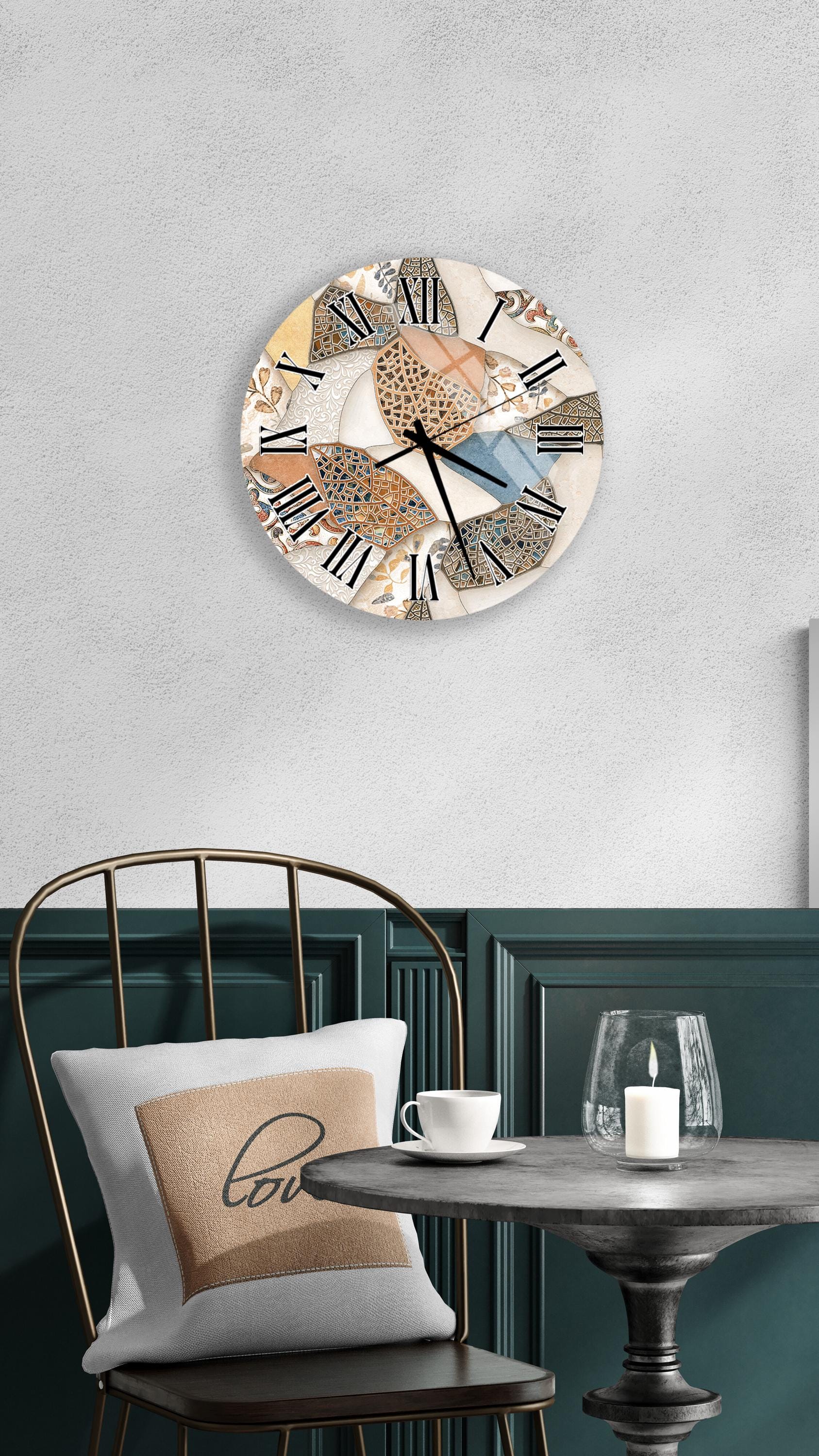 a modern and stylish interior design with a round wall clock, a black metal chair, a white table, and a beige pillow with the word "love" on it.