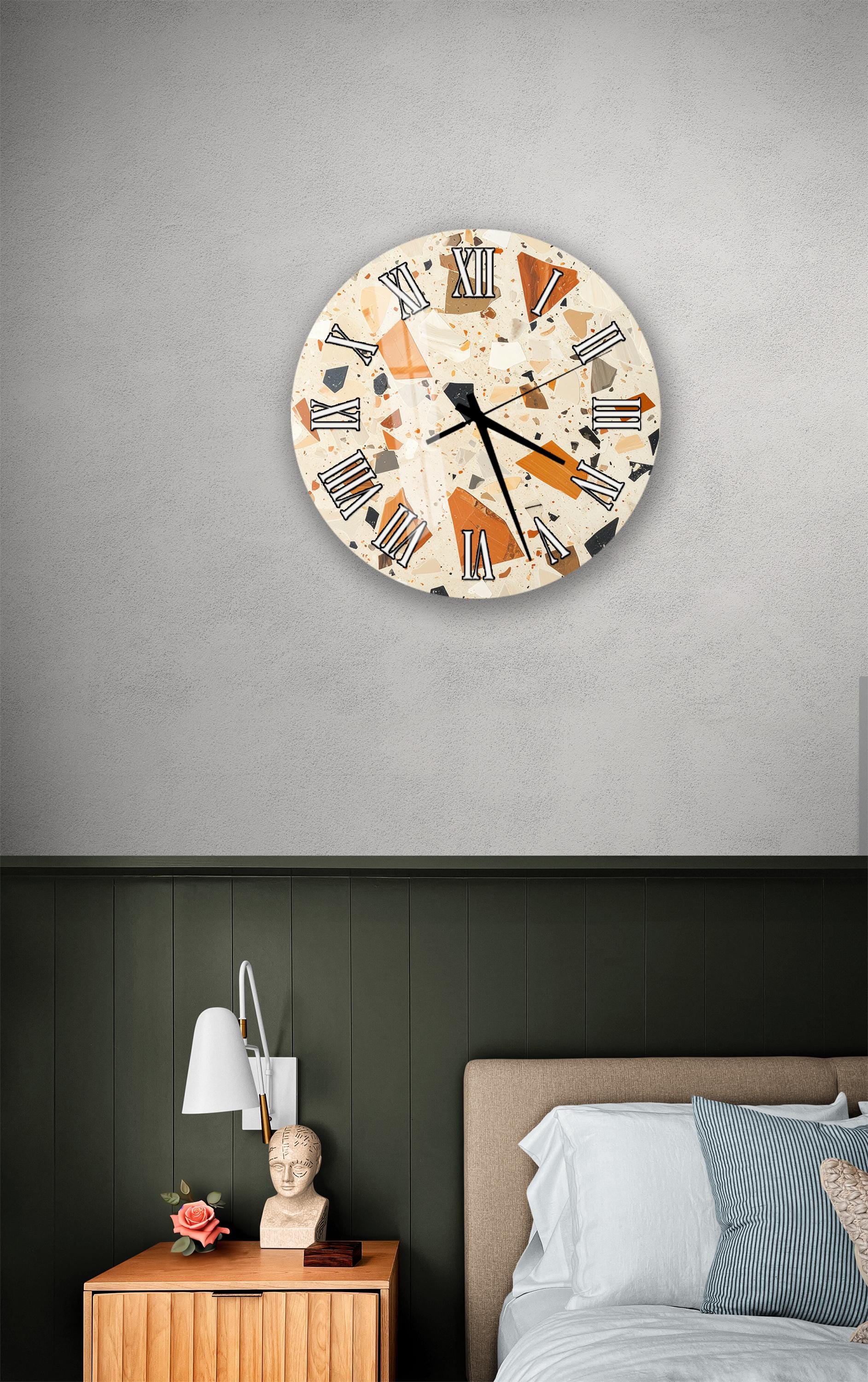 a bedroom setting with a wall clock, a nightstand, and a bed.