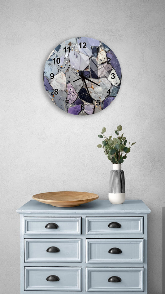 a clock with a mosaic design on a wall above a light blue dresser with six drawers. The dresser has a wooden tray on top and a vase with greenery on the surface.