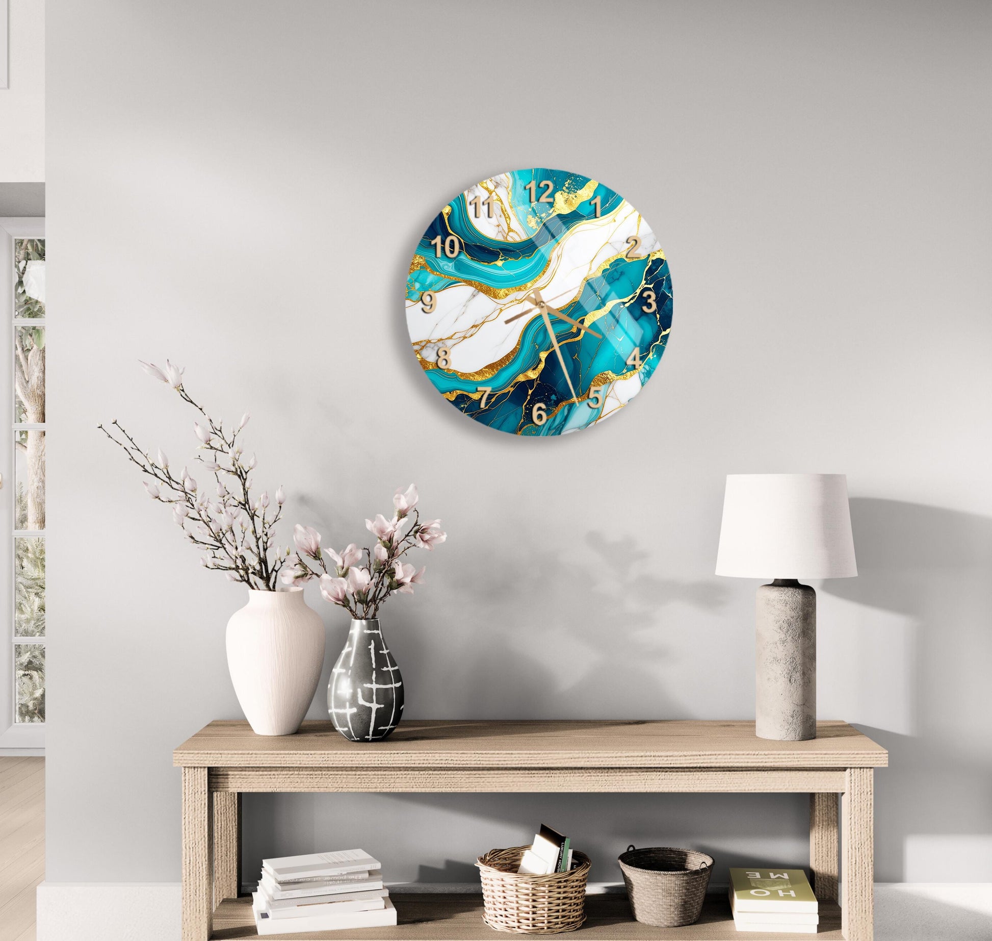 a modern living room with a wooden console table, a round wall clock with a marble-like design, a vase with pink flowers, and a lamp on the table.