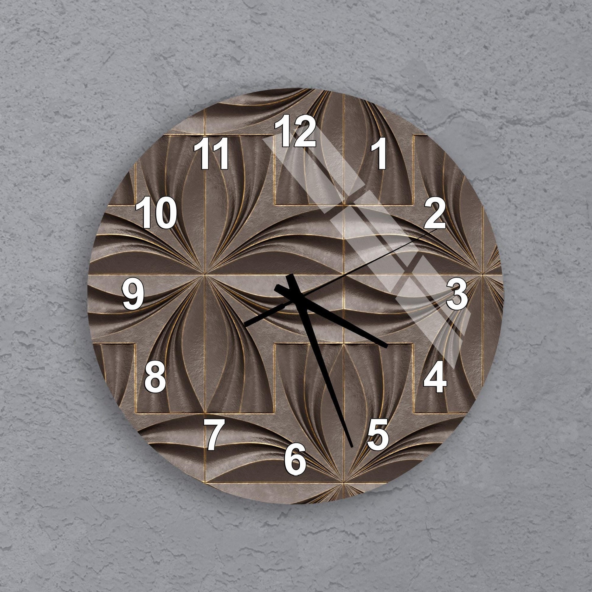 A wall clock with a unique, abstract design featuring a repeating pattern of swirls and lines.