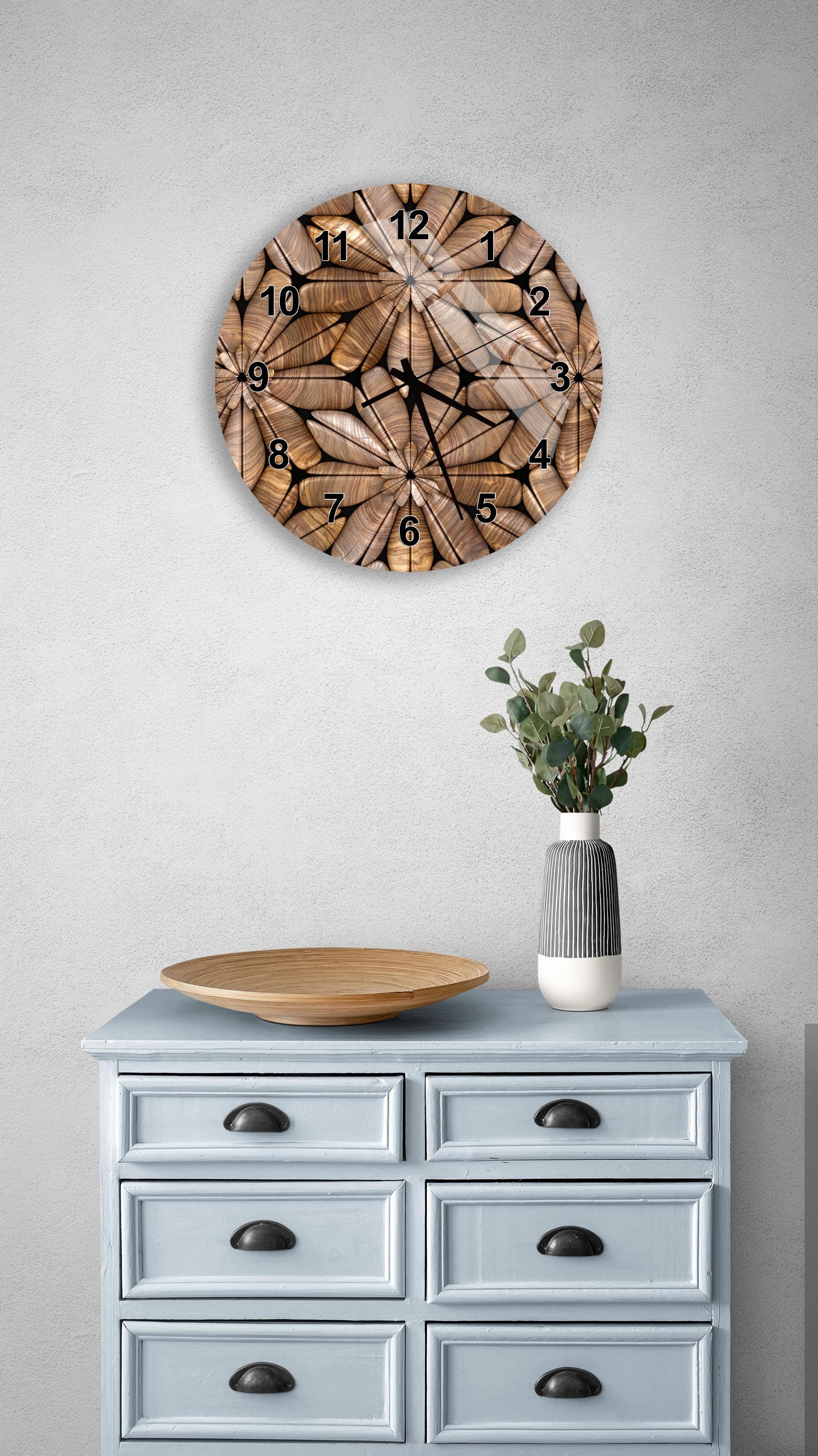 a wall clock with a wooden design, a wooden tray, a vase with greenery, and a light blue dresser with six drawers.