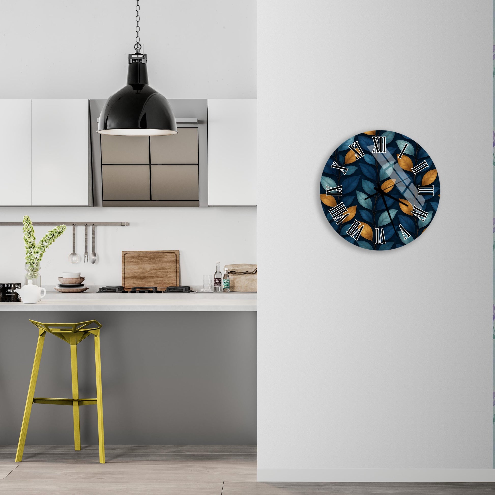 a modern kitchen with a white countertop, a yellow stool, and a wall clock with a blue and orange design.