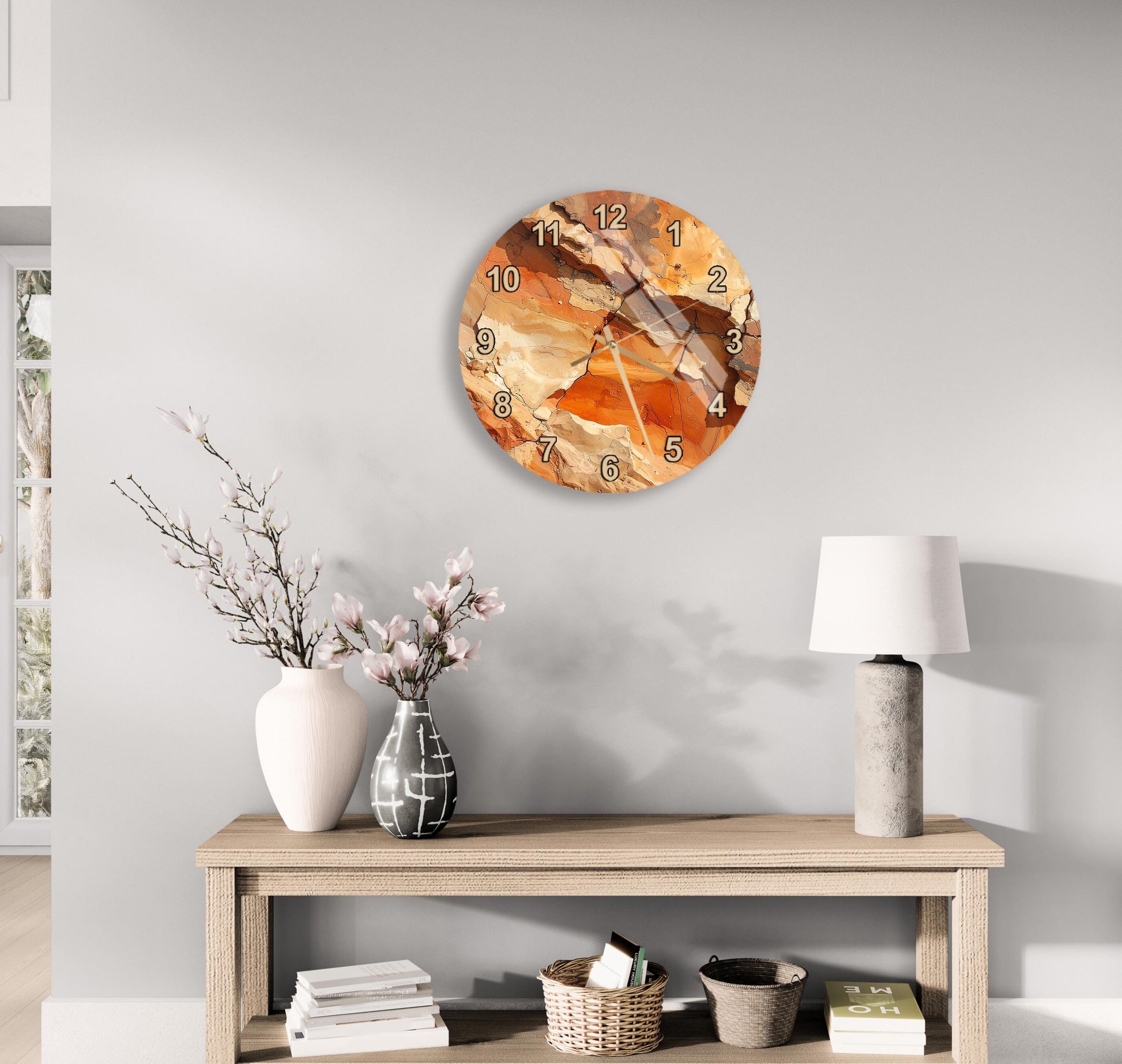 a modern living room with a wooden table displaying a vase of flowers, a lamp, and a clock. The clock has a unique, abstract design with orange and brown colors.