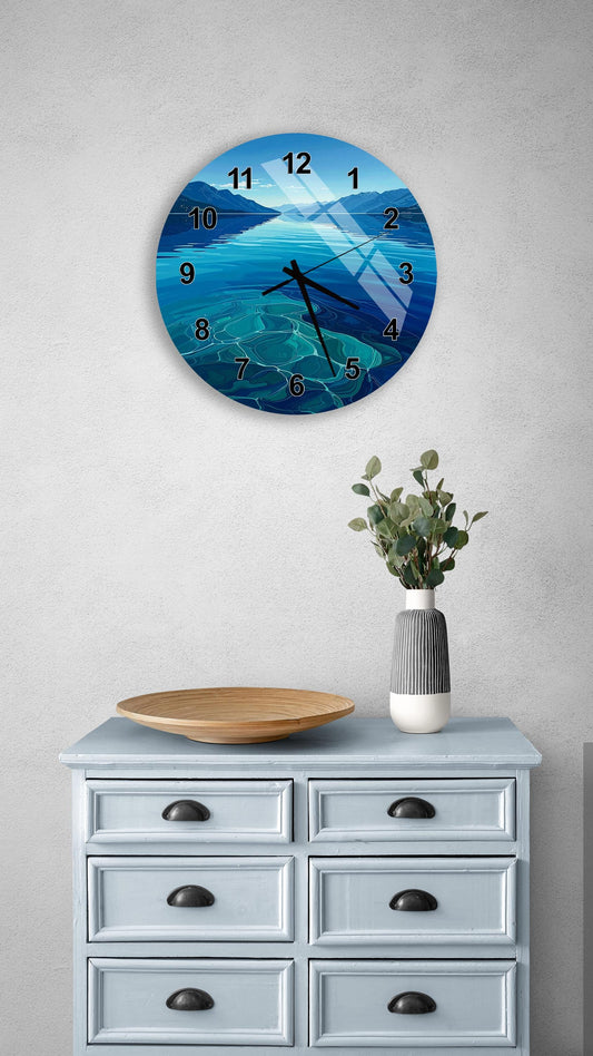 a wall clock with a blue ocean scene, a wooden bowl, and a vase of greenery on a light blue dresser.
