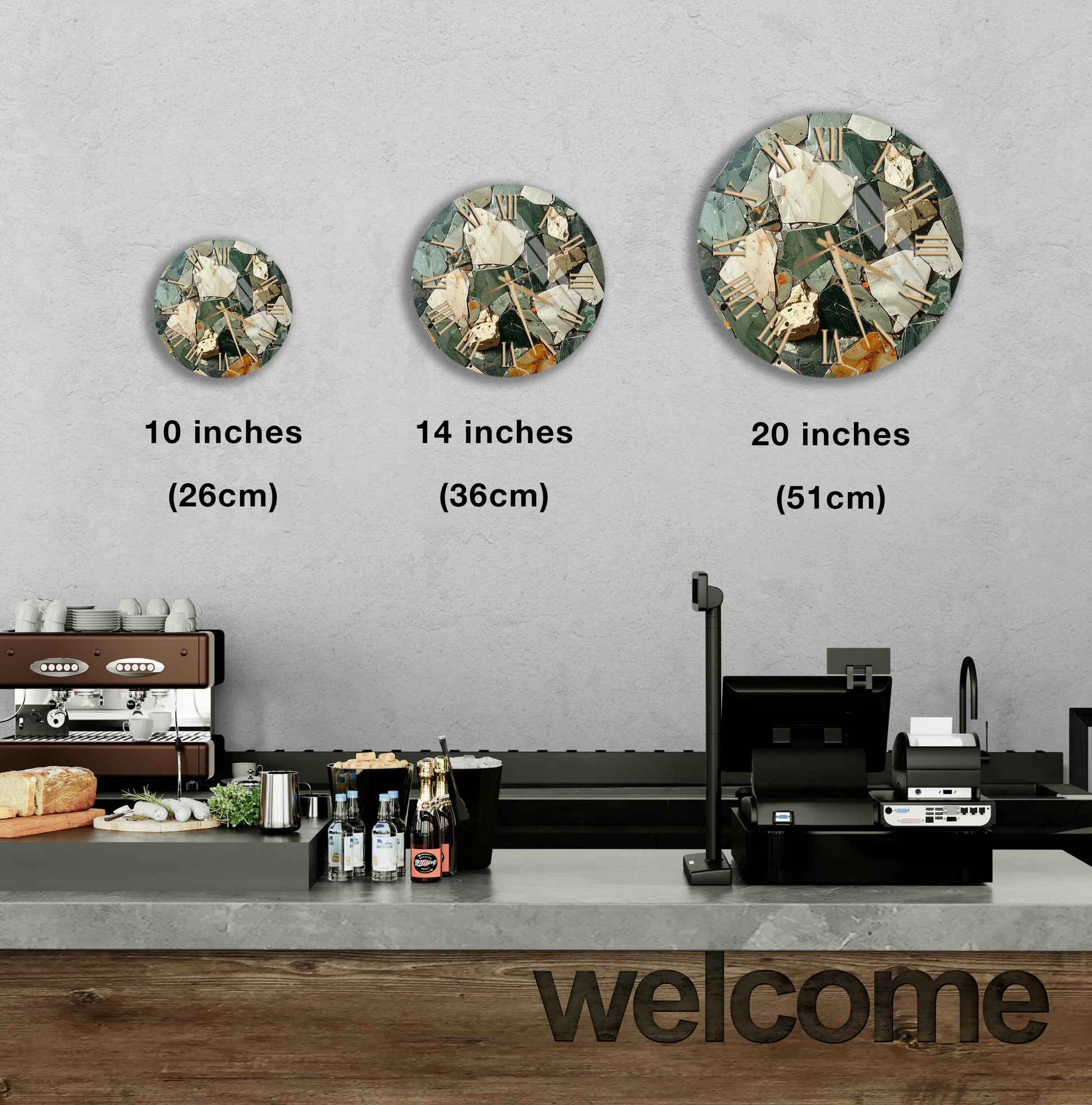 a counter in a restaurant with a "welcome" sign, and three round wall decals of different sizes are displayed above the counter.