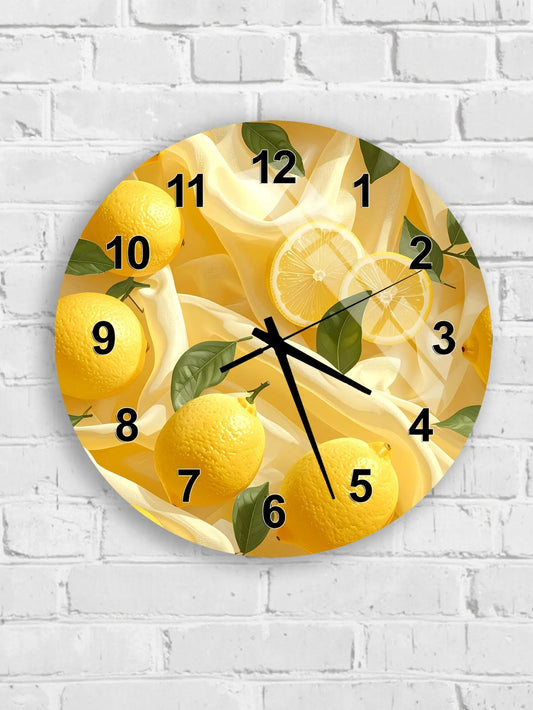 A round wall clock with a design featuring yellow lemons and green leaves.
