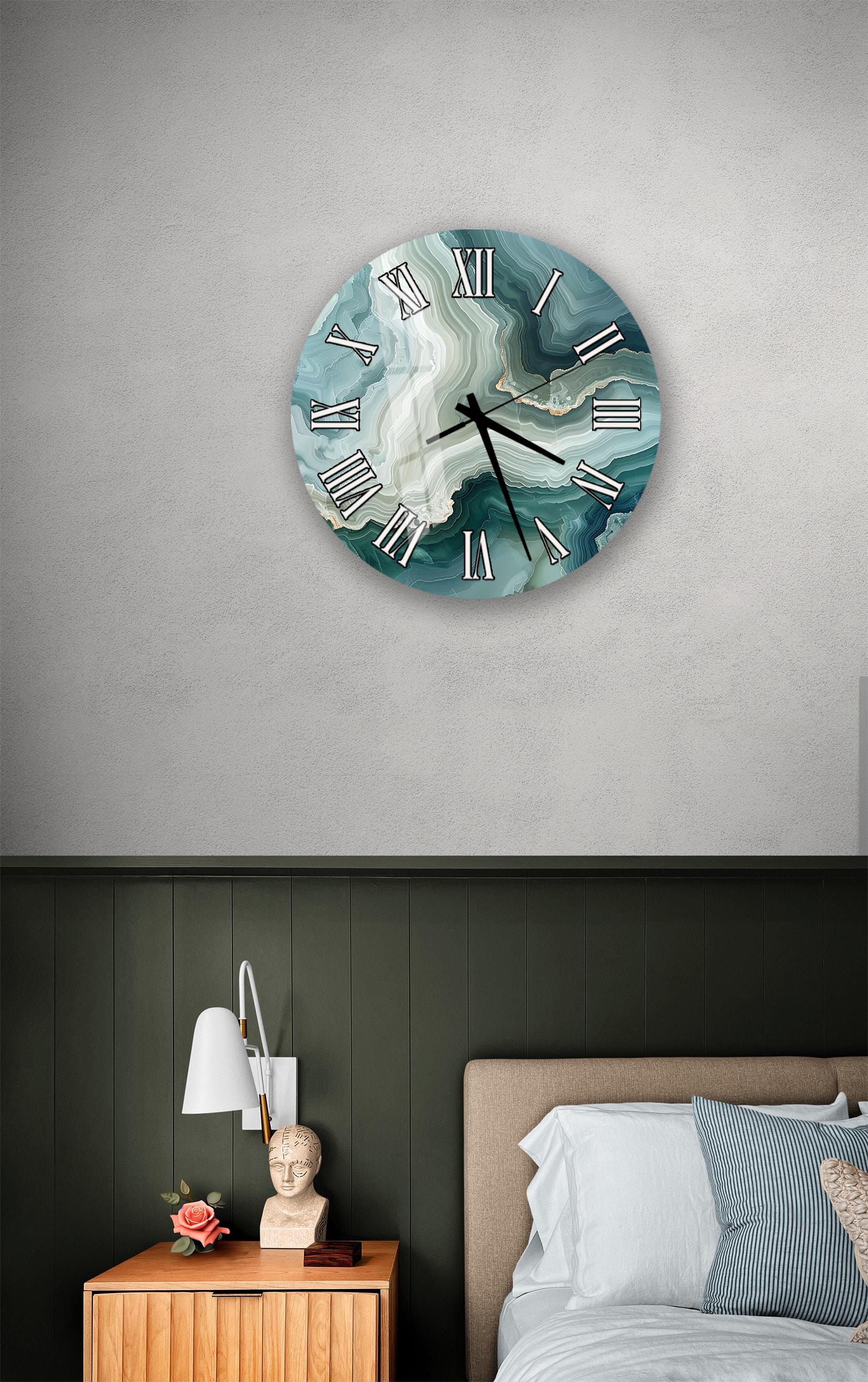 a bedroom setting with a wall clock, a nightstand, and a bed.