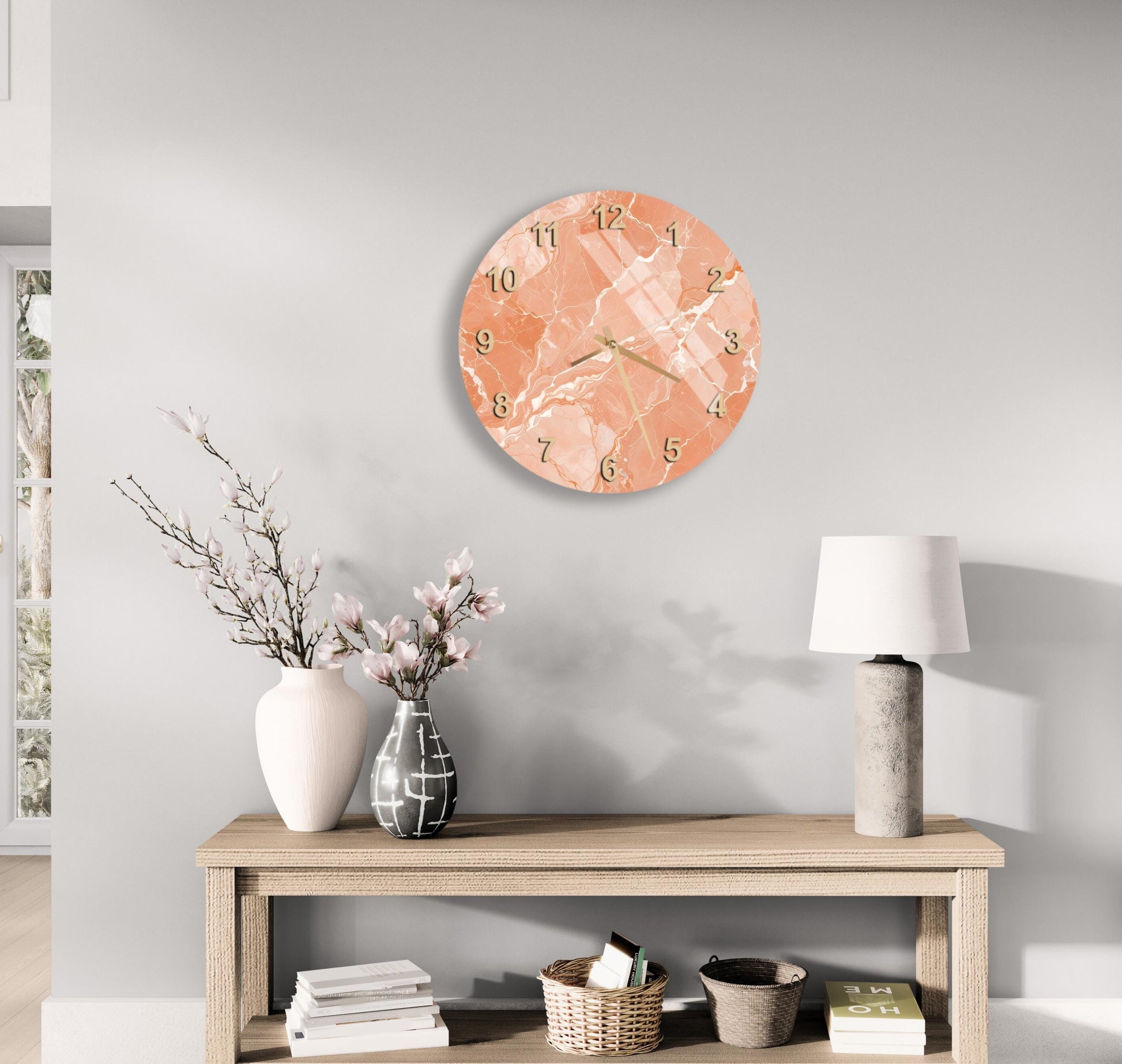a modern living room with a wooden table, a lamp, a clock, and a vase with flowers. The clock has a marble-like design and is mounted on the wall above the table.