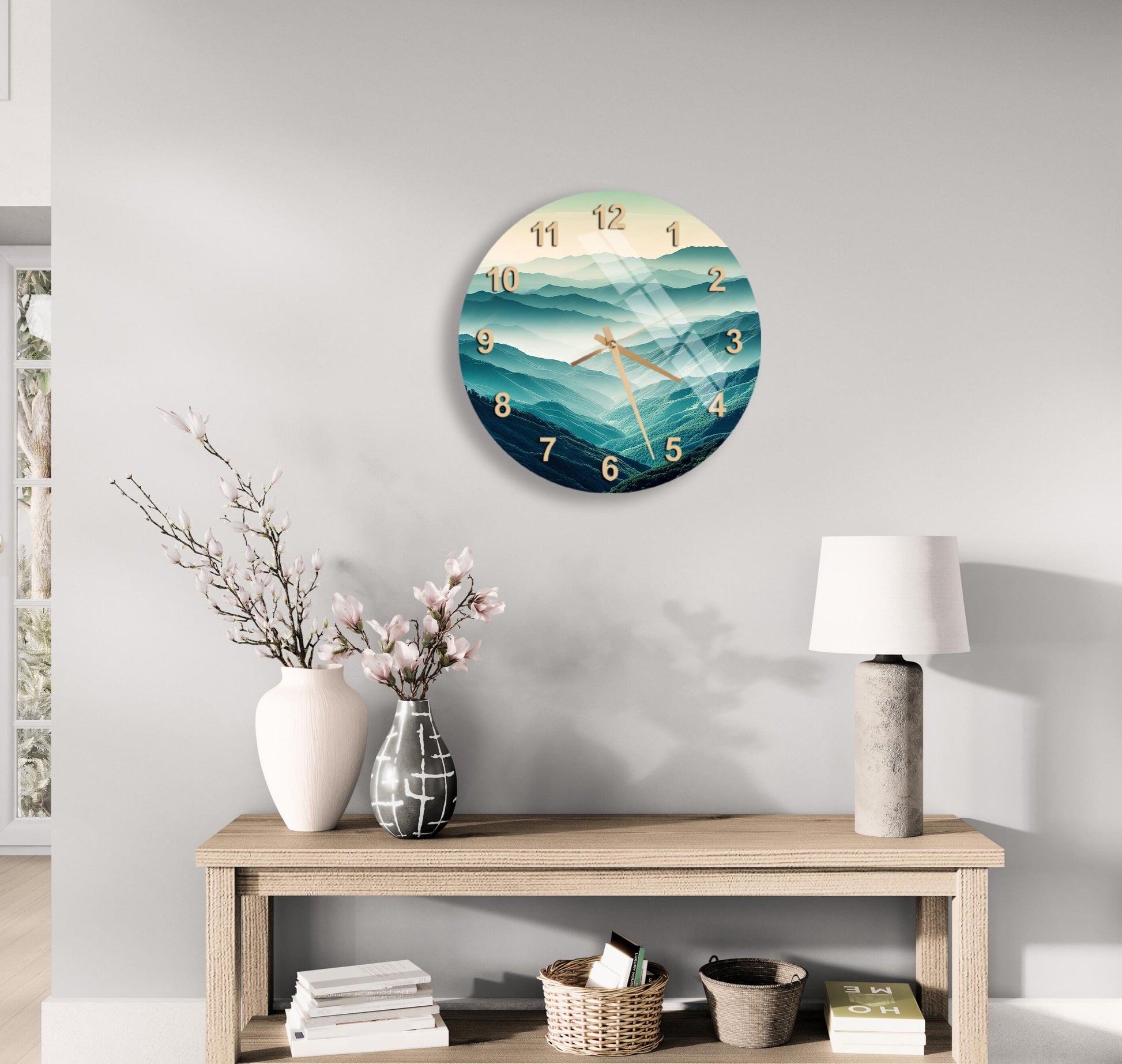 a clock on the wall above a table with flowers
