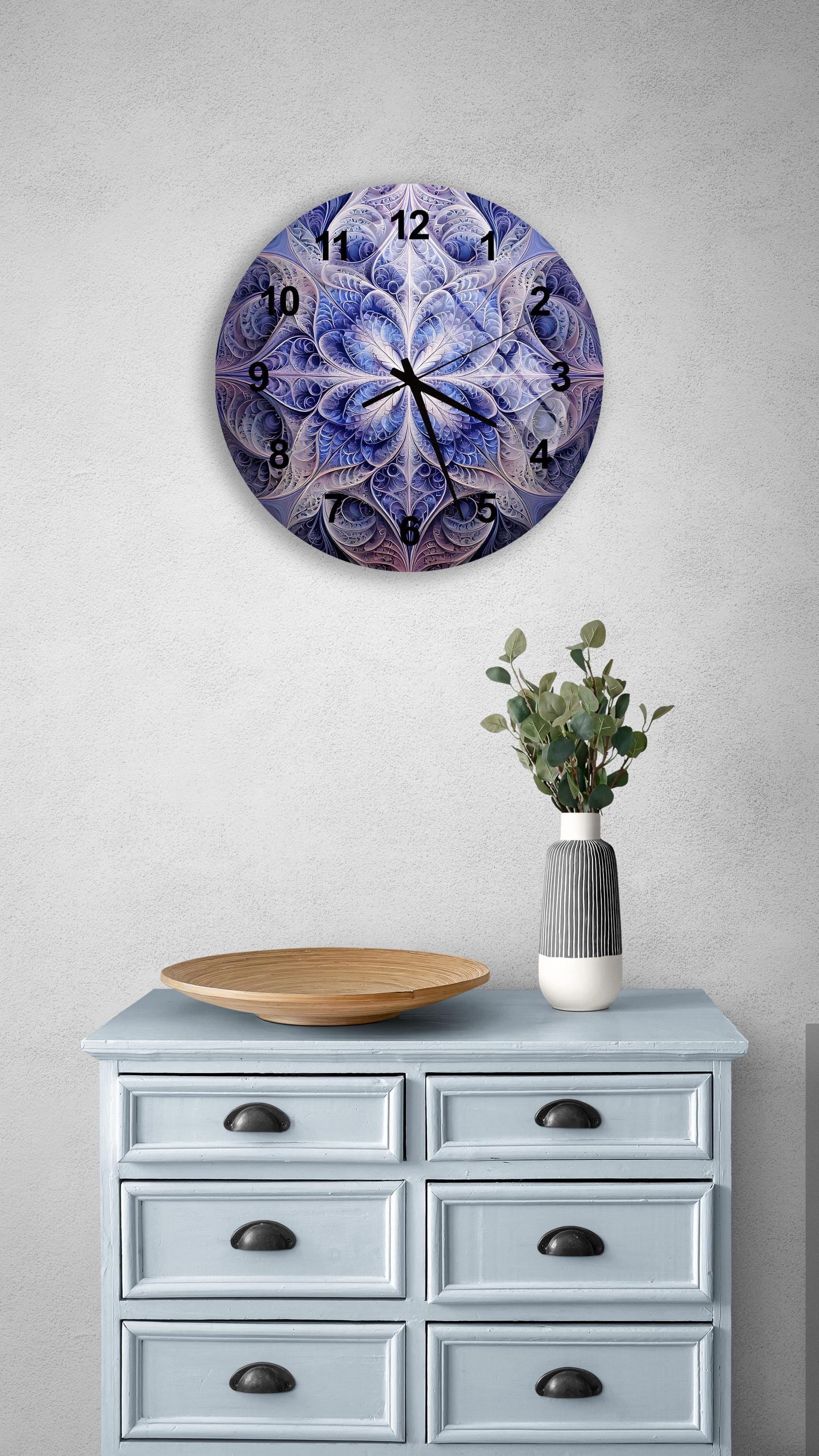 a clock on a wall above a dresser