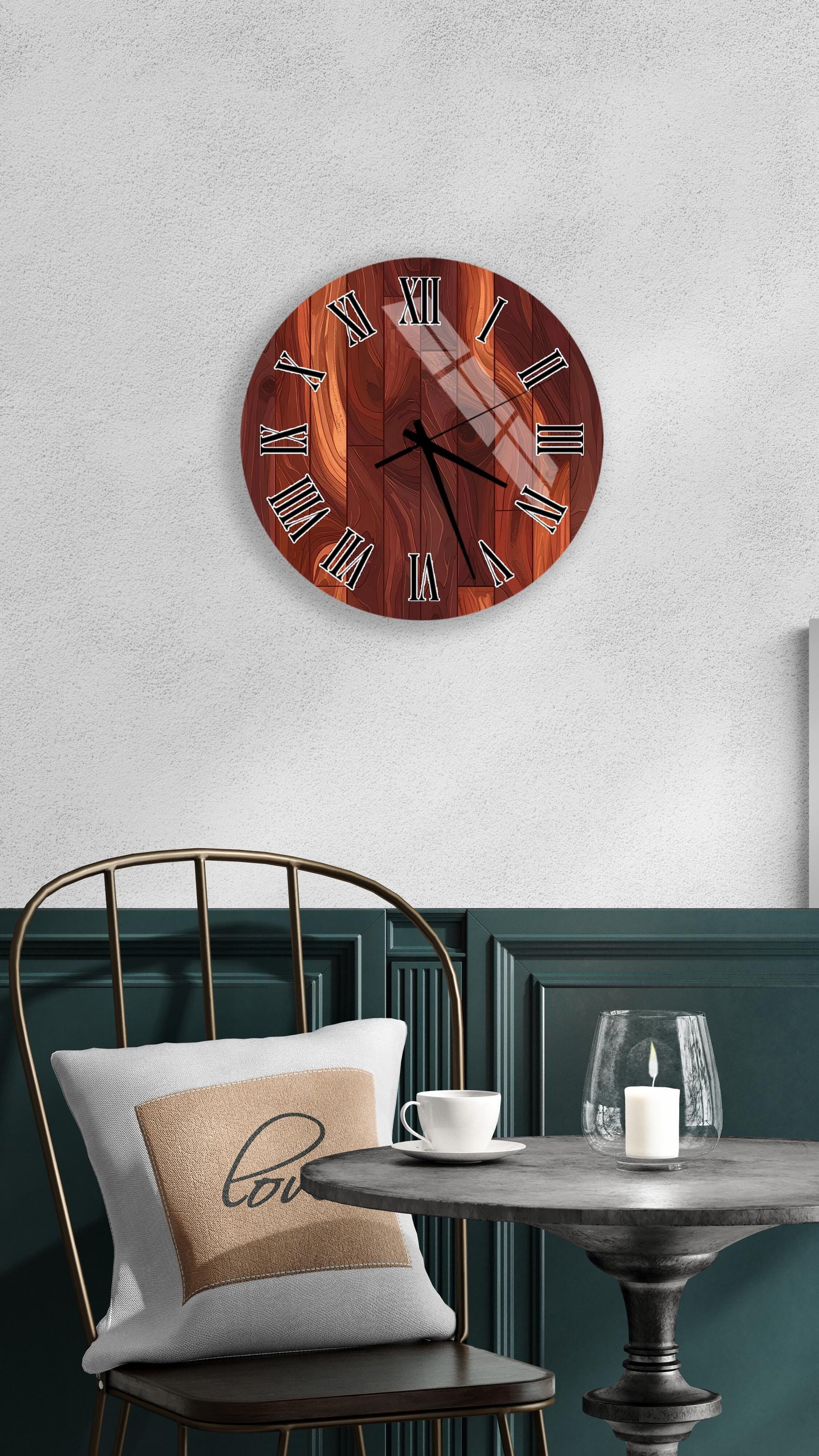 a wooden clock with Roman numerals mounted on a wall above a table with a white tablecloth and a candle.