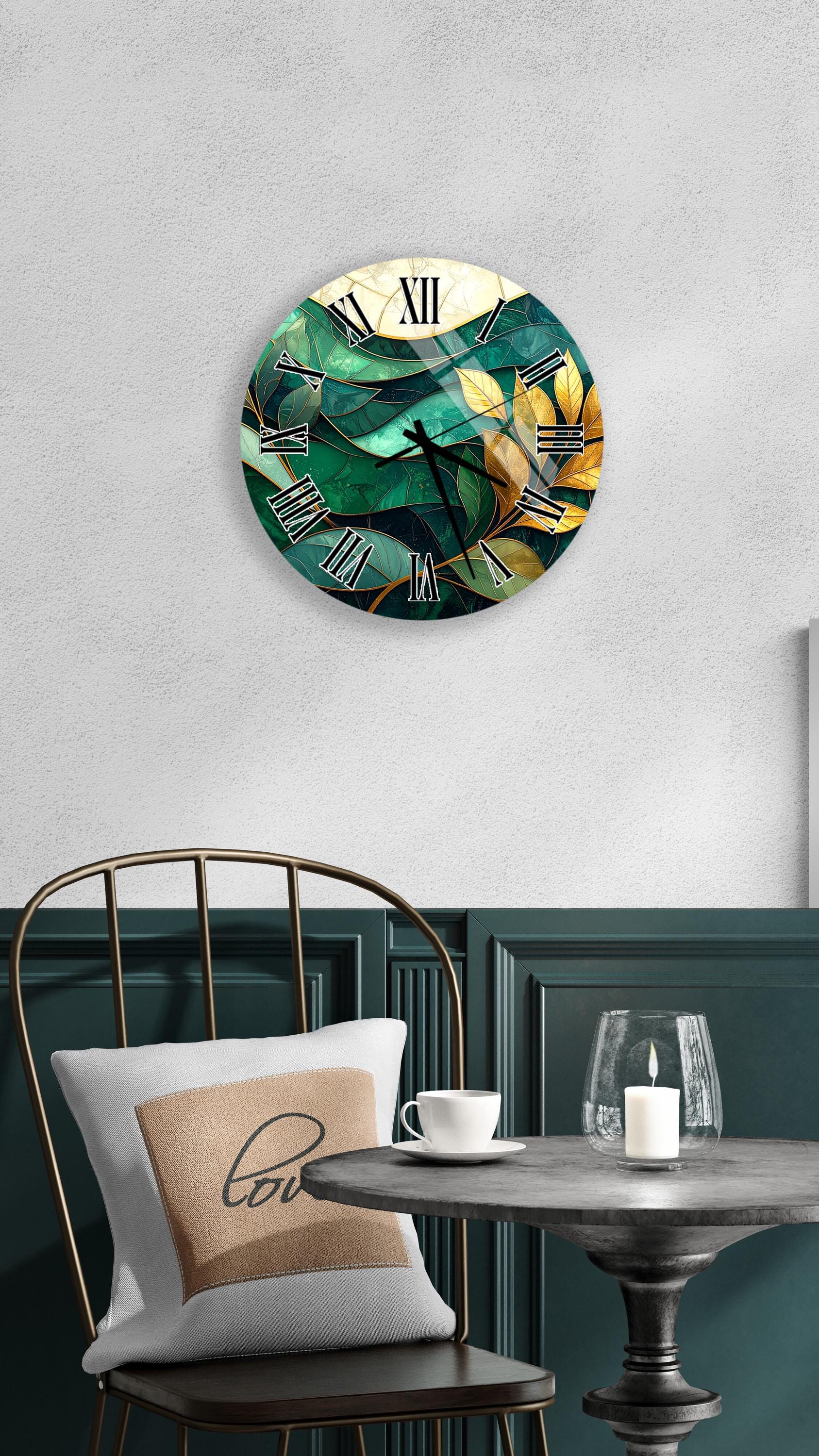 a modern, round wall clock with a green and yellow abstract design, mounted on a white wall above a dining table with a white tablecloth.