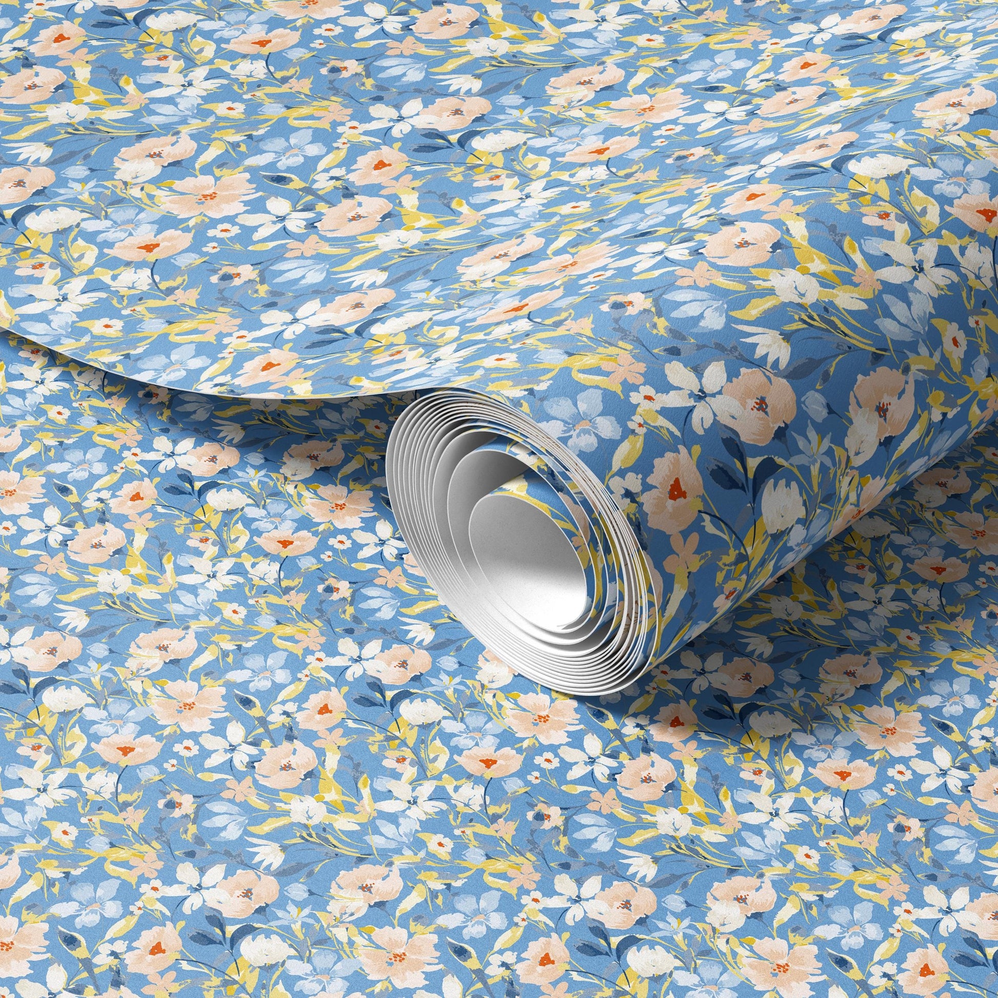 a roll of blue and white floral patterned wallpaper.
