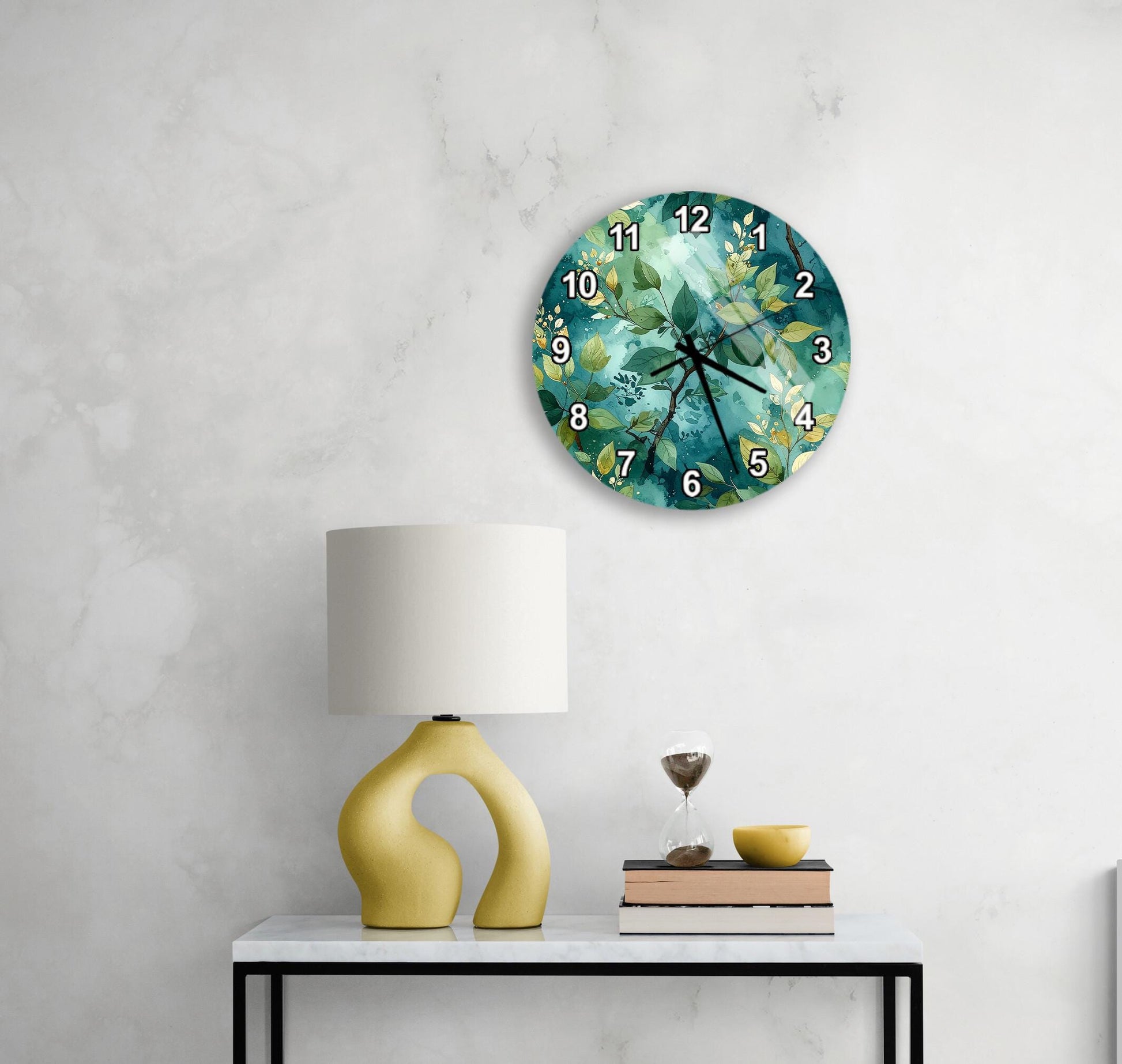 a white wall with a round clock displaying the time, a yellow lamp on a white table, and a stack of books and a glass of wine on the table.