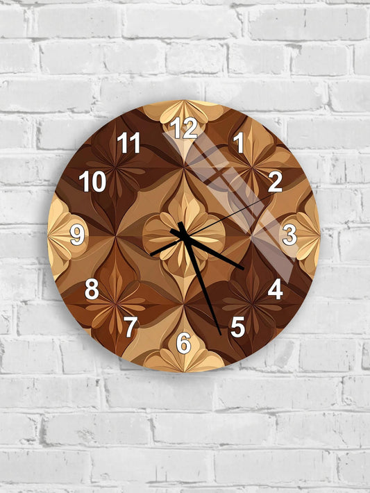 A wall clock with a brown floral design on its face, mounted on a white brick wall.