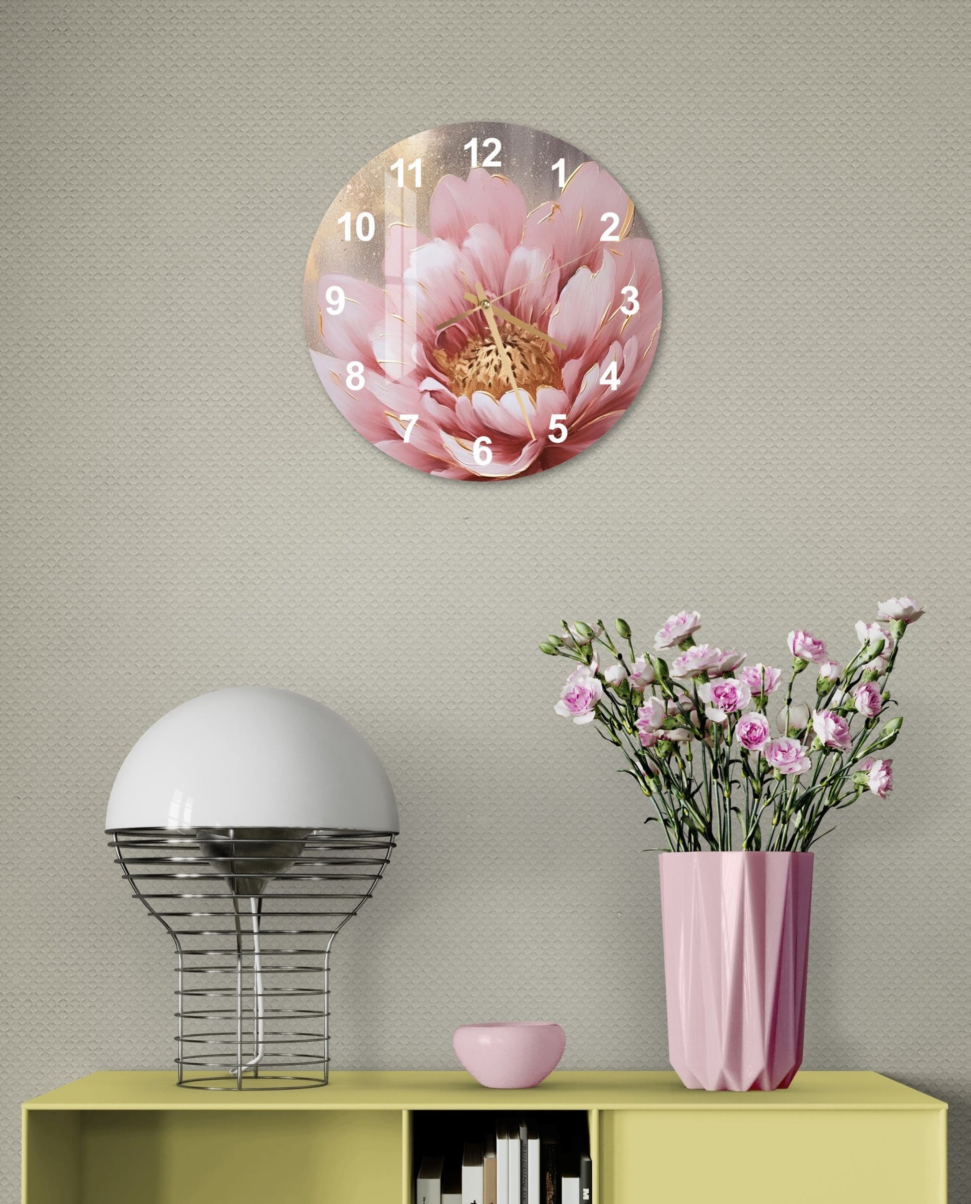 a clock on a wall above a table with a vase of flowers