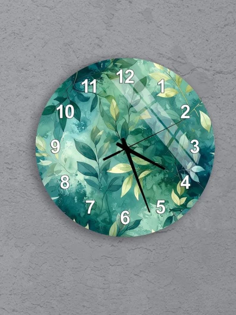 six round wall clocks with a green leaf design, arranged in a grid pattern on a gray background.