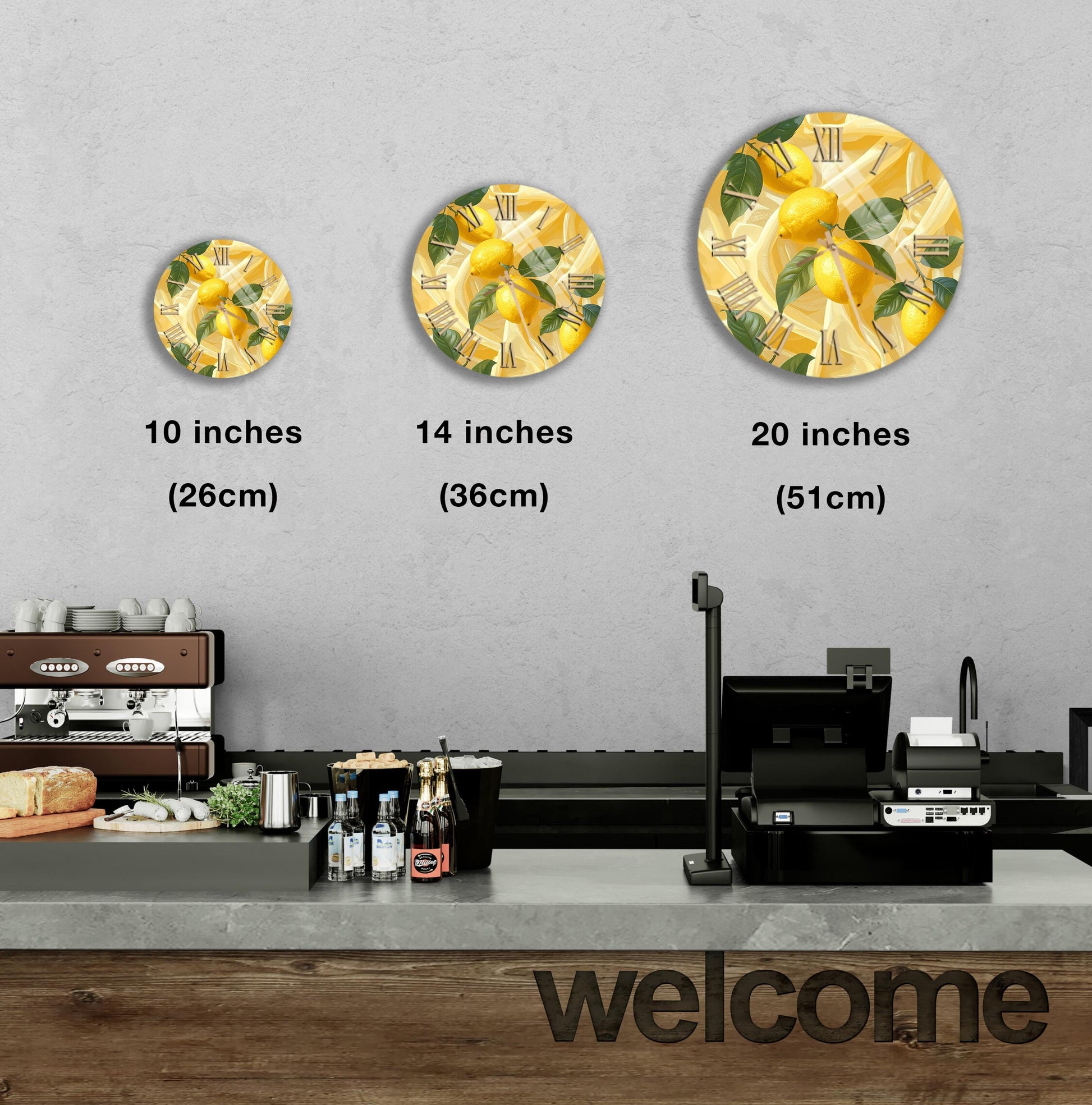 a counter with a cash register, a coffee machine, and a welcome sign. There are three different sizes of lemon-themed wall clocks displayed above the counter.