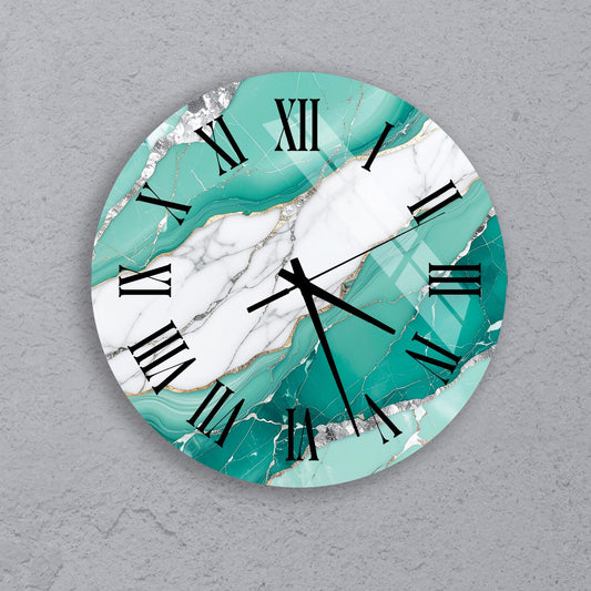 A round wall clock with a marble-like design in shades of turquoise and white.