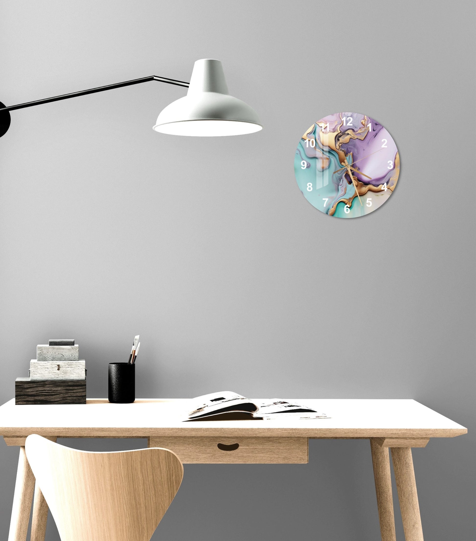 a desk with a chair and a clock on the wall
